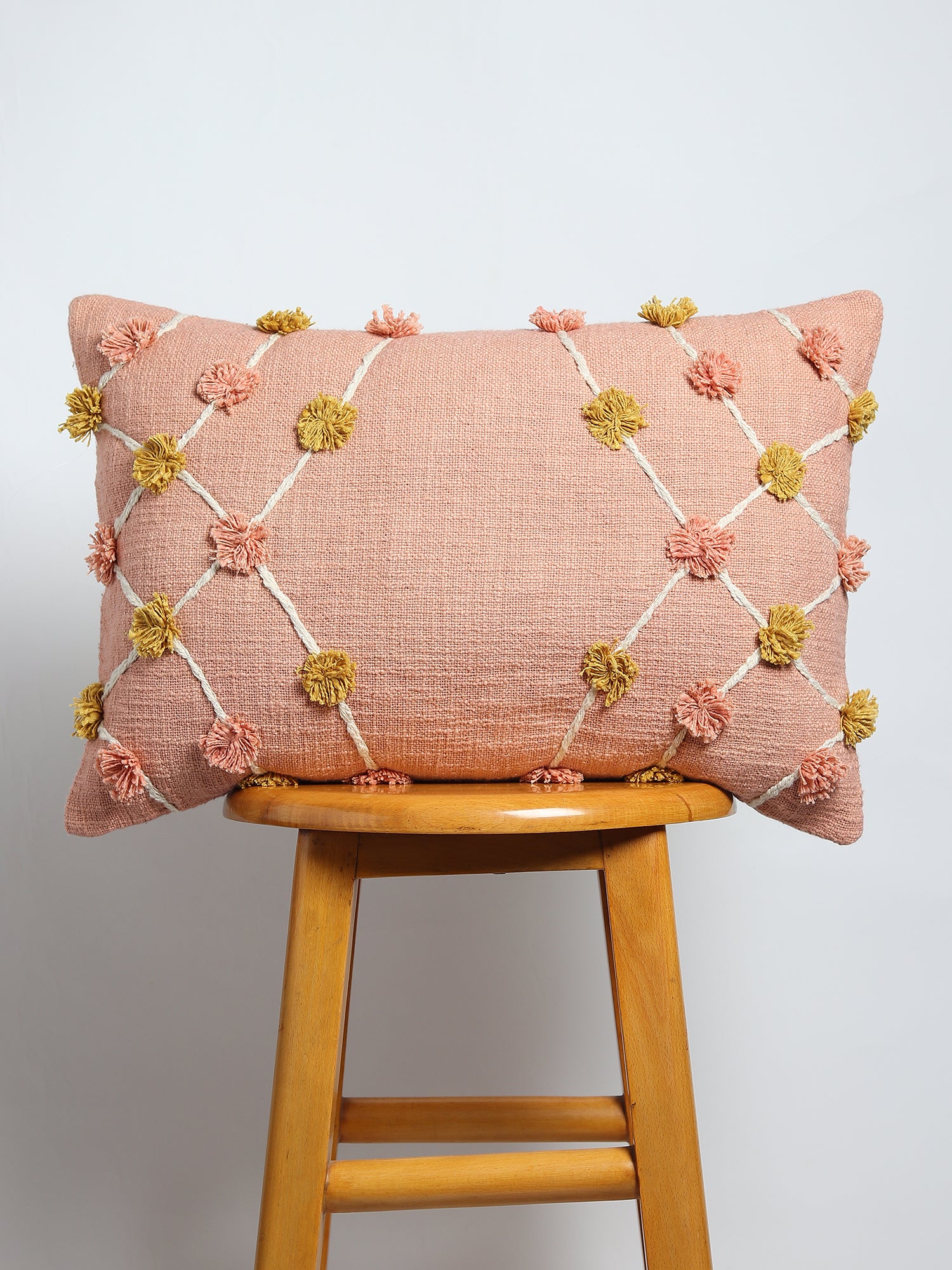 Overdyed embroidered lumbar cushion on sofa — Art Avenue