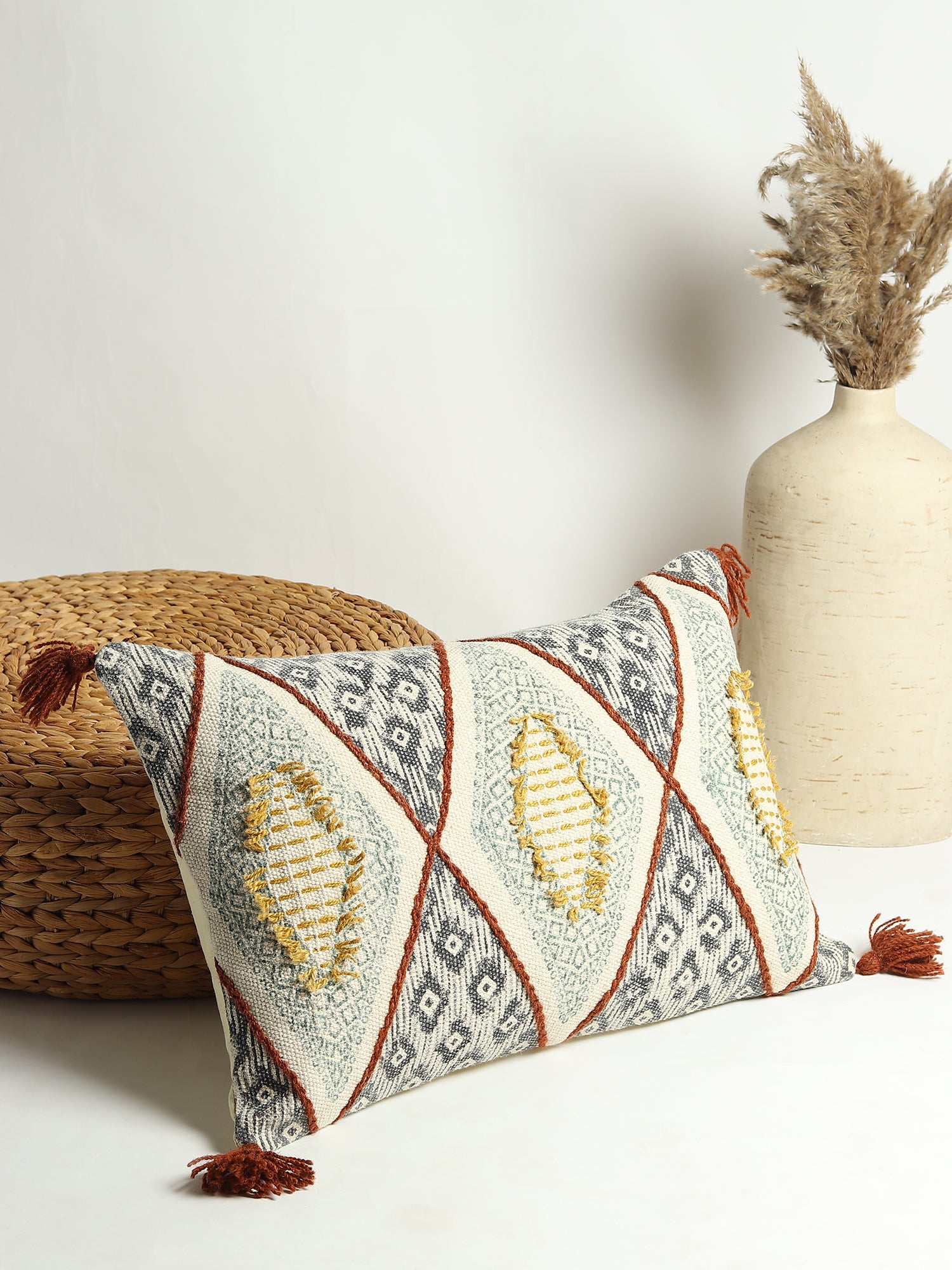 Block-printed embroidered lumbar cushion on sofa — Art Avenue