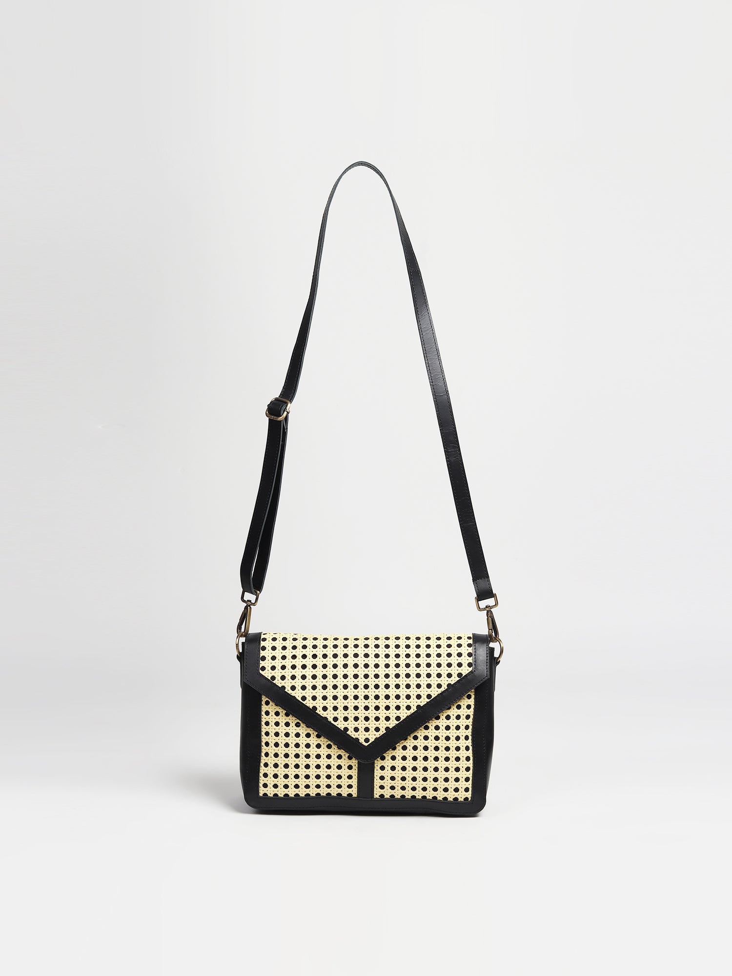 Jaylen leather and cane sling bag, side view — Art Avenue