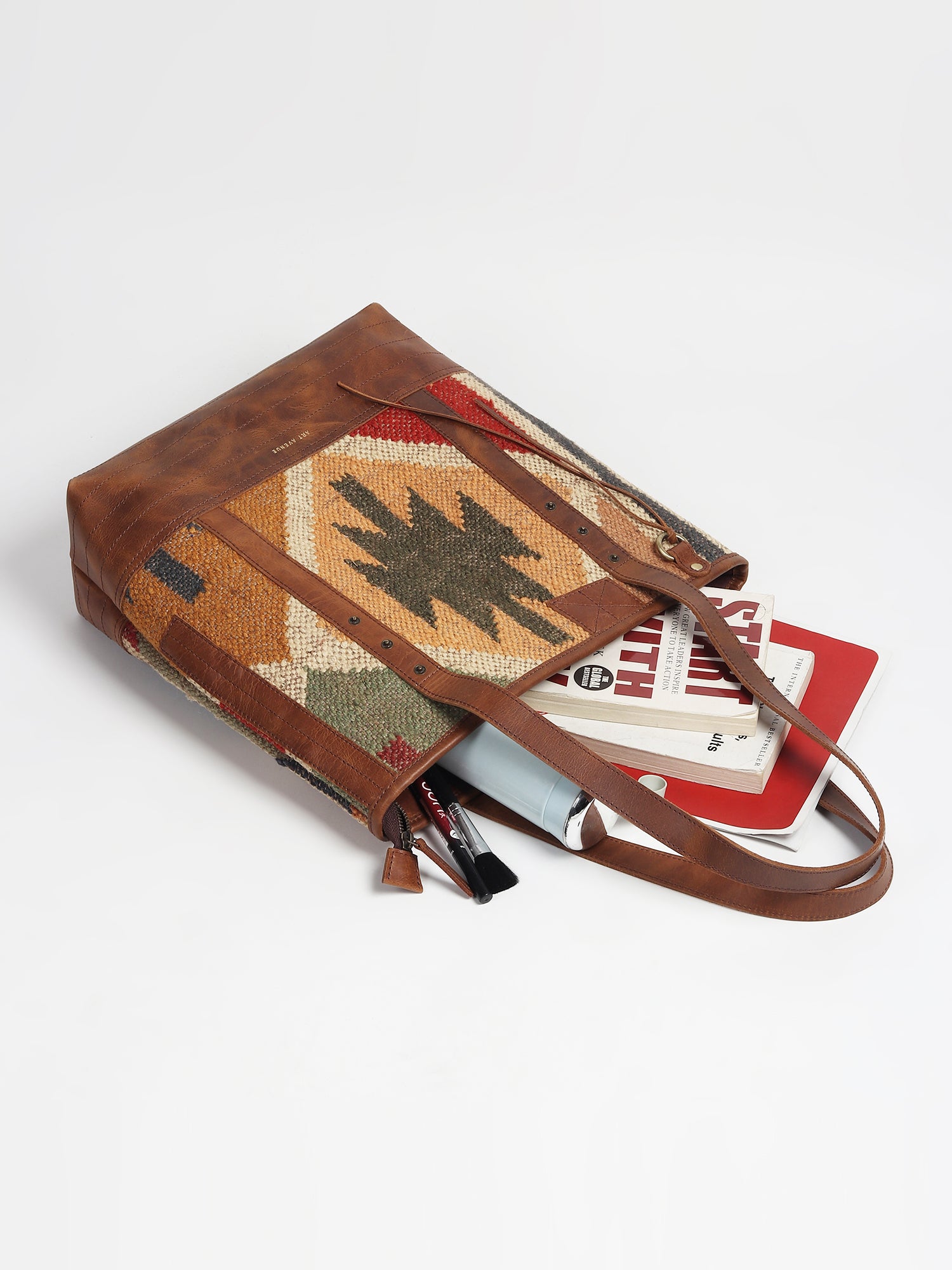 Aneur kilim and leather handbag on model — Art Avenue