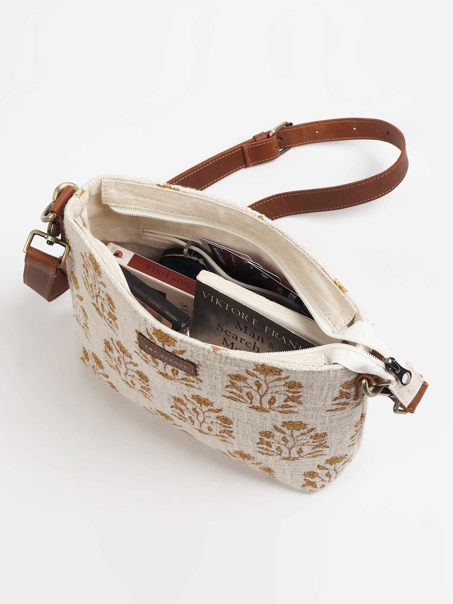 Charlie leather sling bag on model — Art Avenue