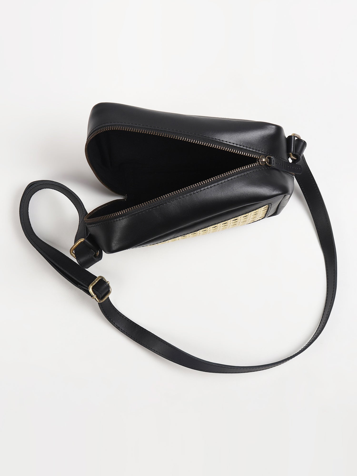 Laremy cane and leather sling bag lifestyle — Art Avenue