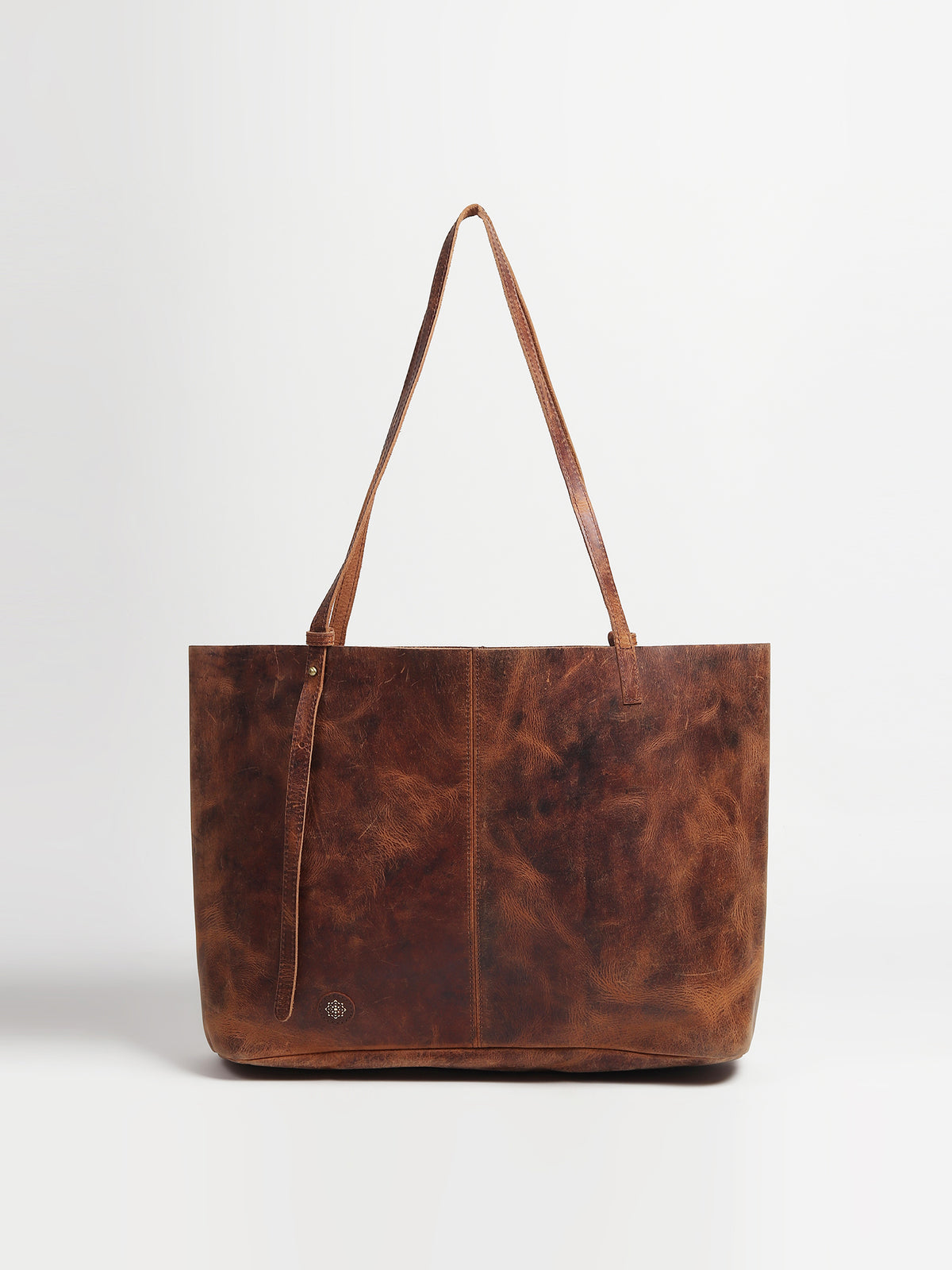 Avarice leather tote bag flat lay — Art Avenue