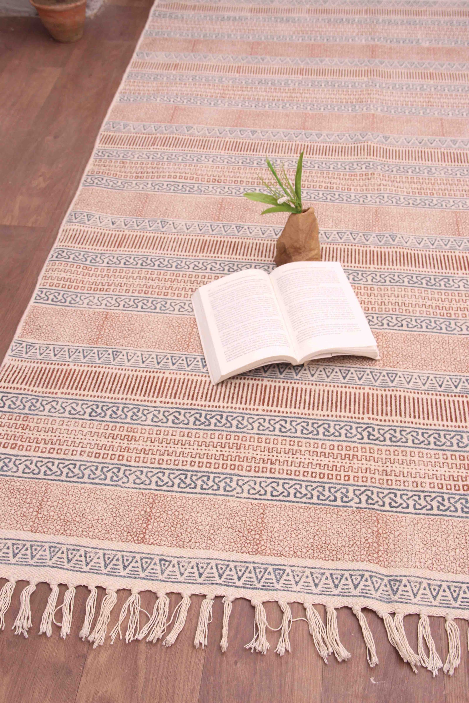 Detail of block-print on red dhurrie rug — Art Avenue