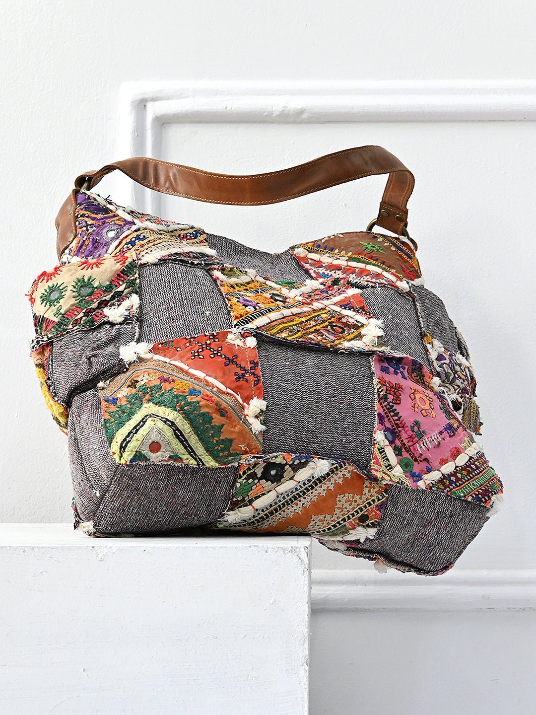 Winked patchwork handbag on model — Art Avenue