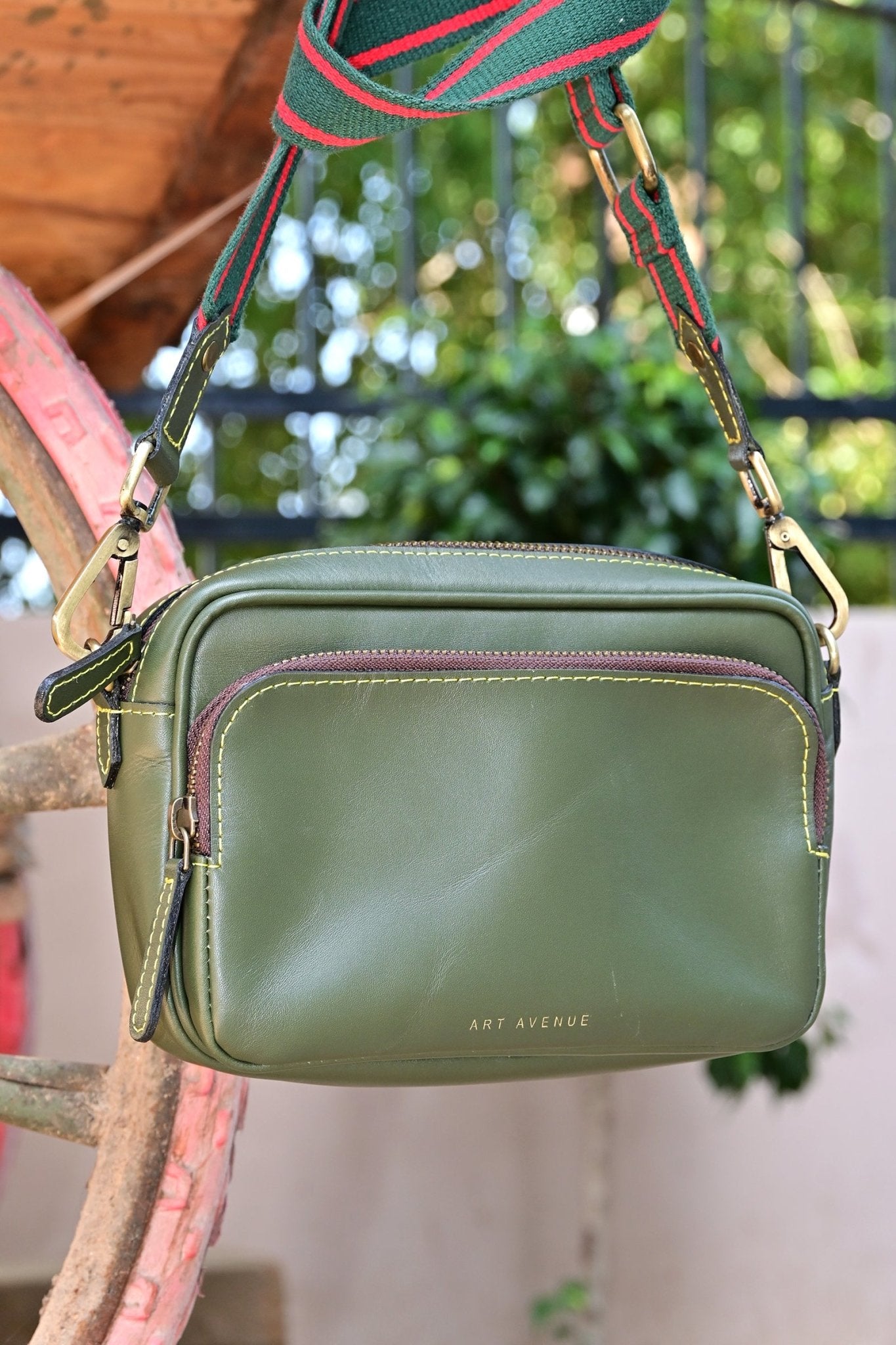 Harisson leather sling bag green hardware detail — Art Avenue