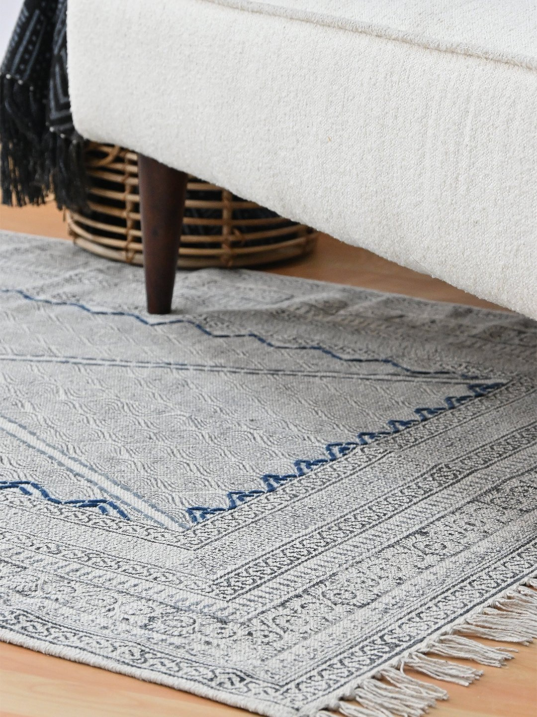 Detail of block-print on white dhurrie rug — Art Avenue