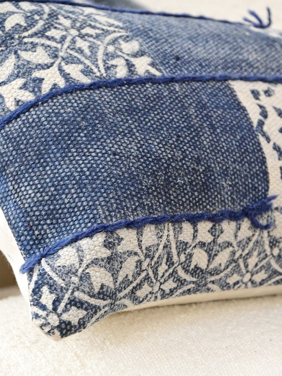 Block-printed embroidered lumbar cushion on sofa — Art Avenue