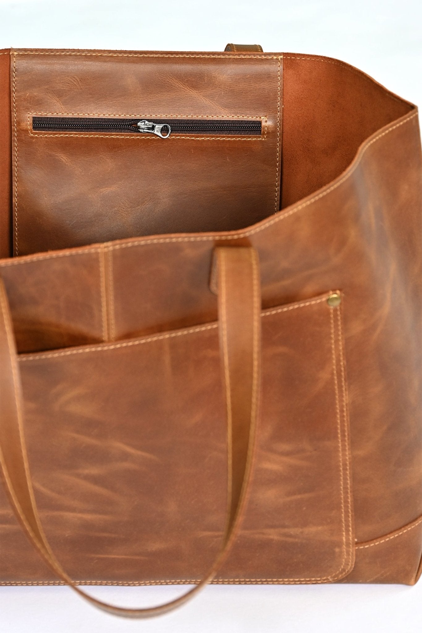 Kelly leather handbag flat lay — Art Avenue