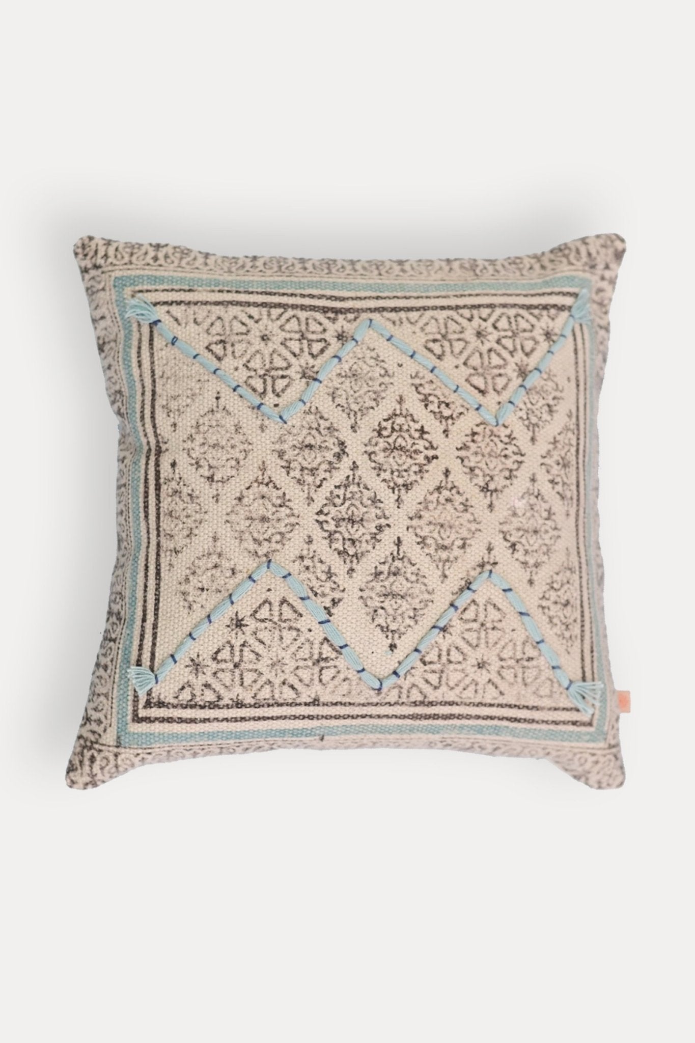 Block-printed square cushion on sofa — Art Avenue