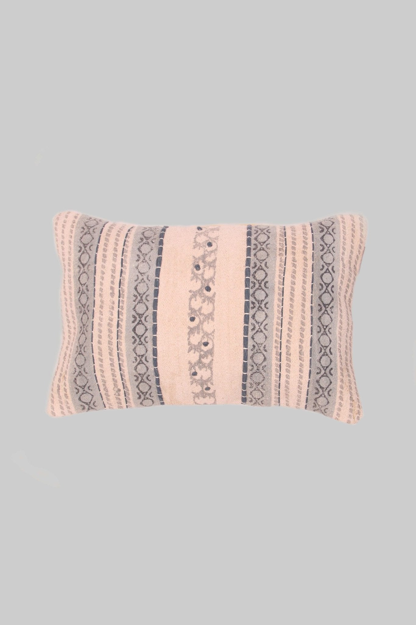 Block-printed embroidered lumbar cushion on sofa — Art Avenue