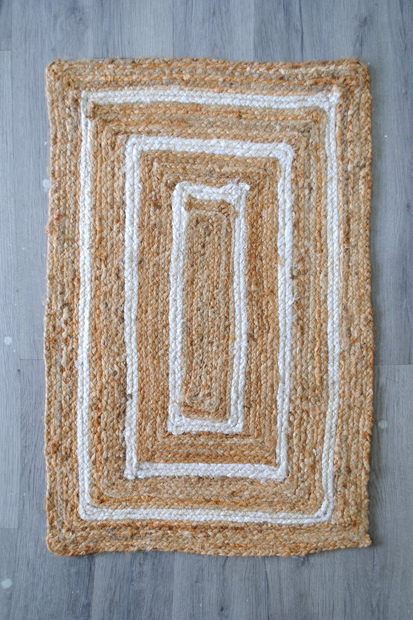 Breton braided jute rug room setting — Art Avenue