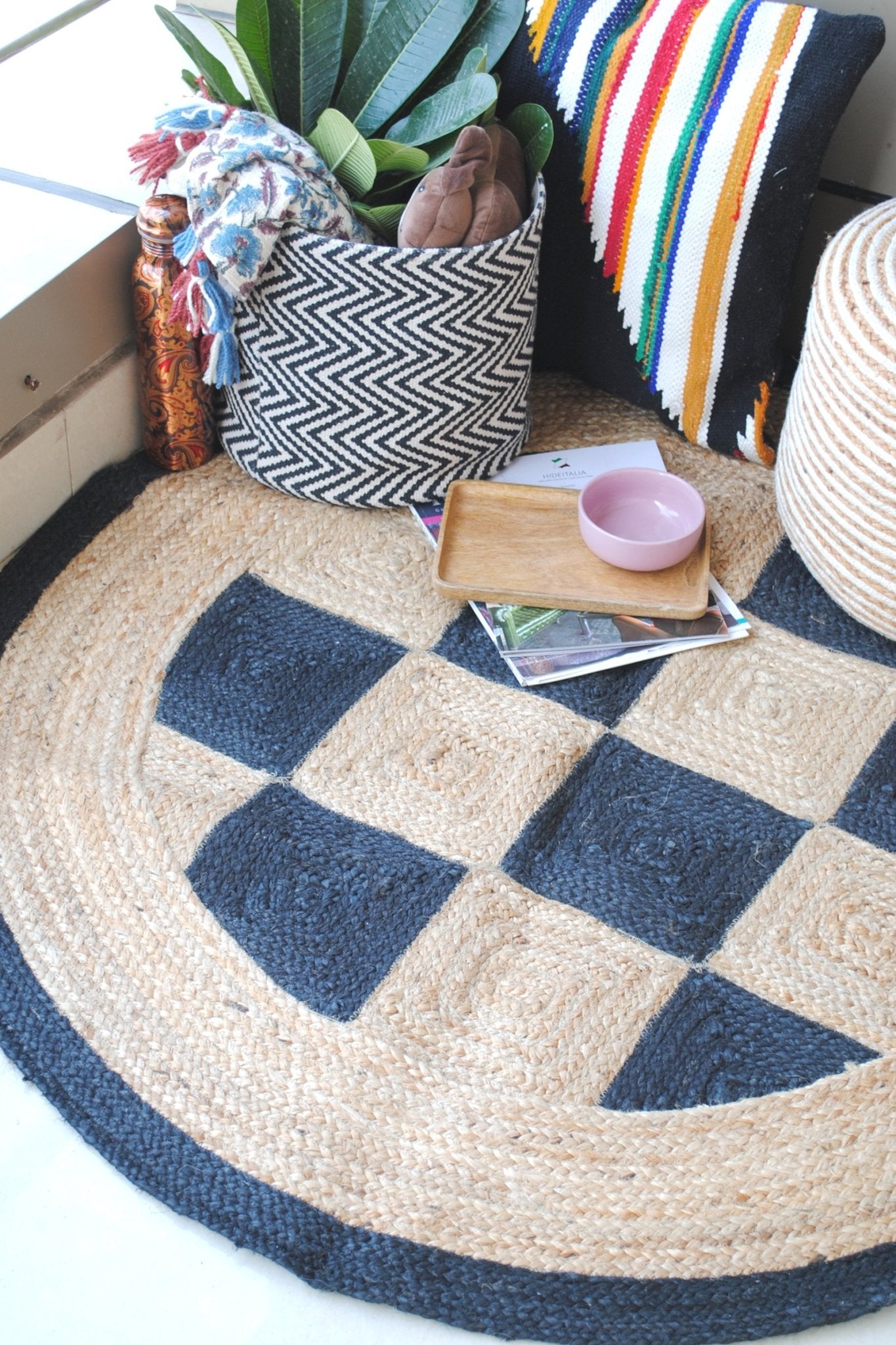 Black and beige checkered round jute rug — hand-braided in Jaipur