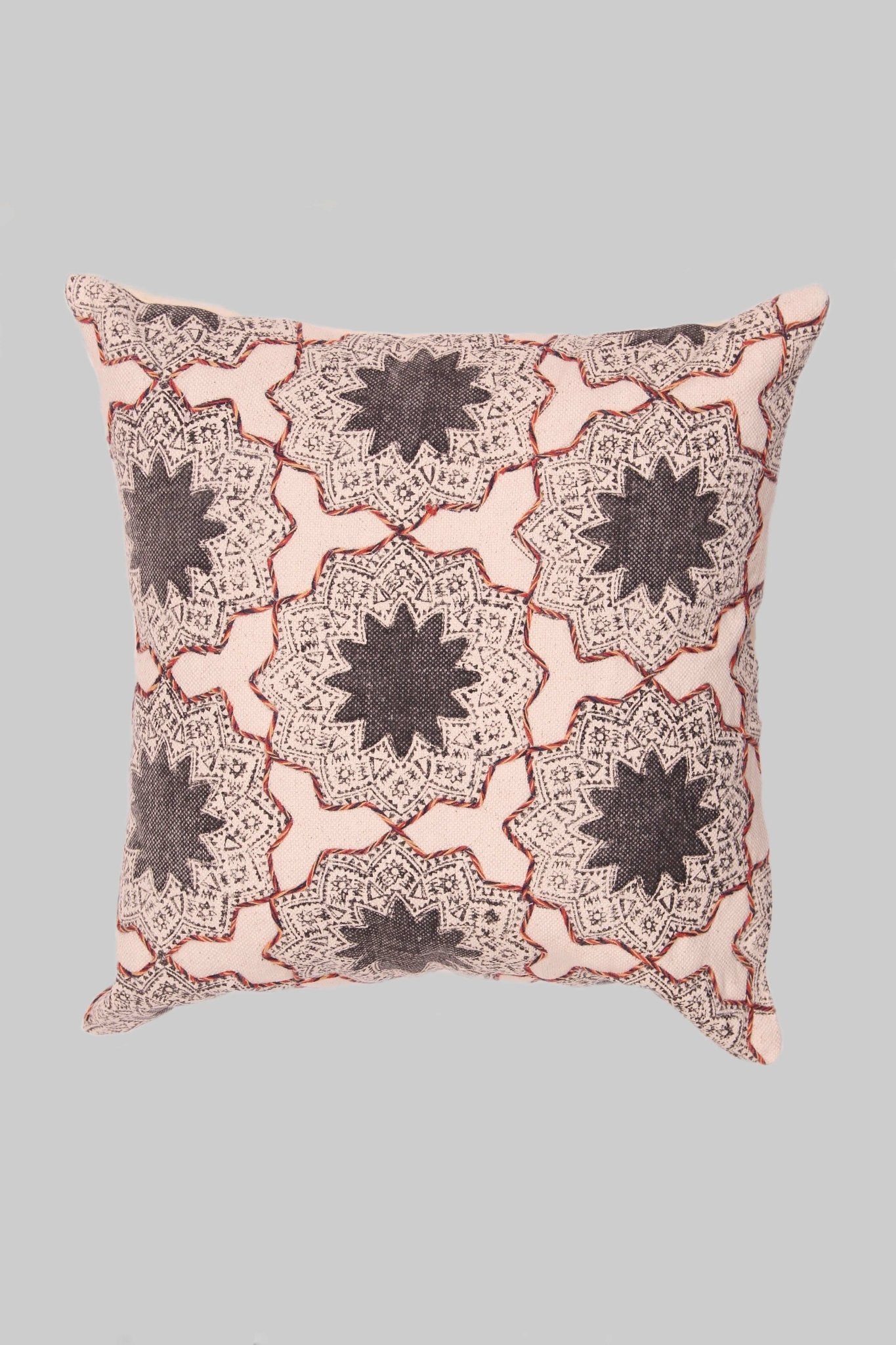 Block-printed square cushion on sofa — Art Avenue