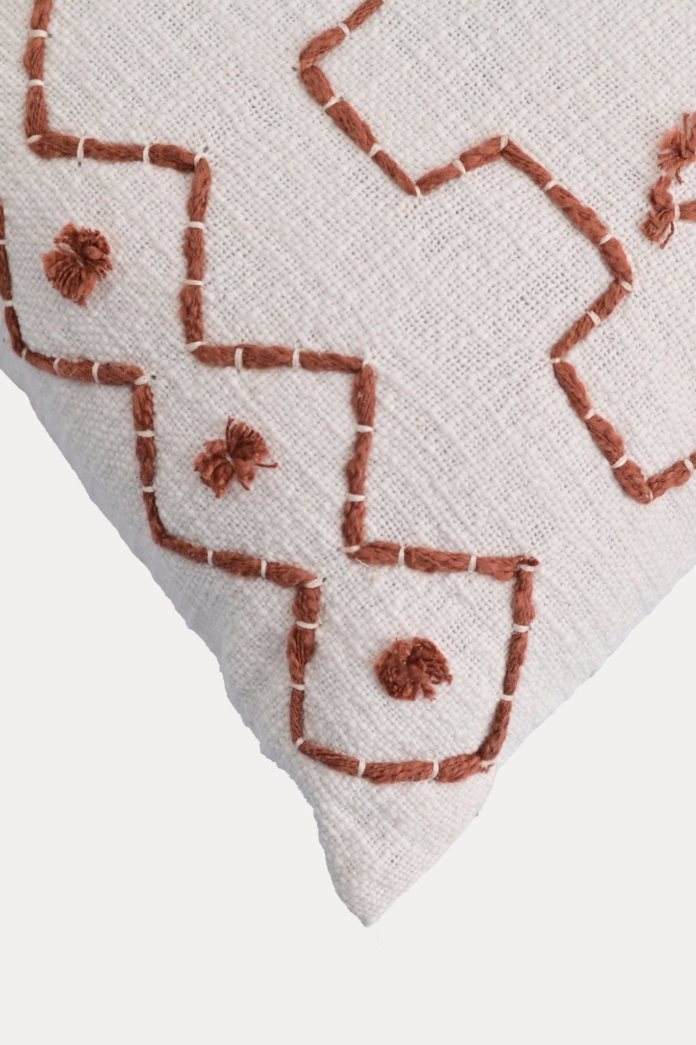 Detail of hand embroidery on white dyed square cushion cover — Art Avenue