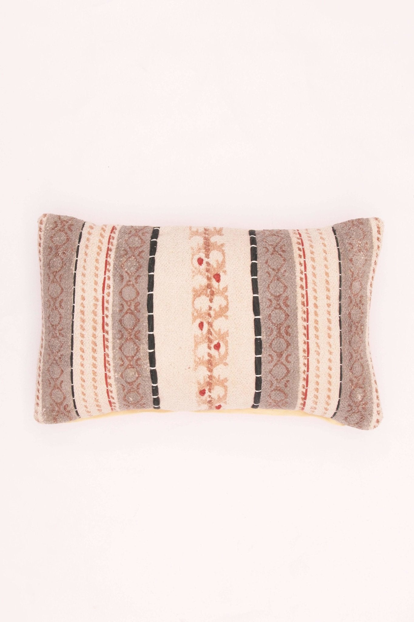 Block-printed embroidered lumbar cushion on sofa — Art Avenue