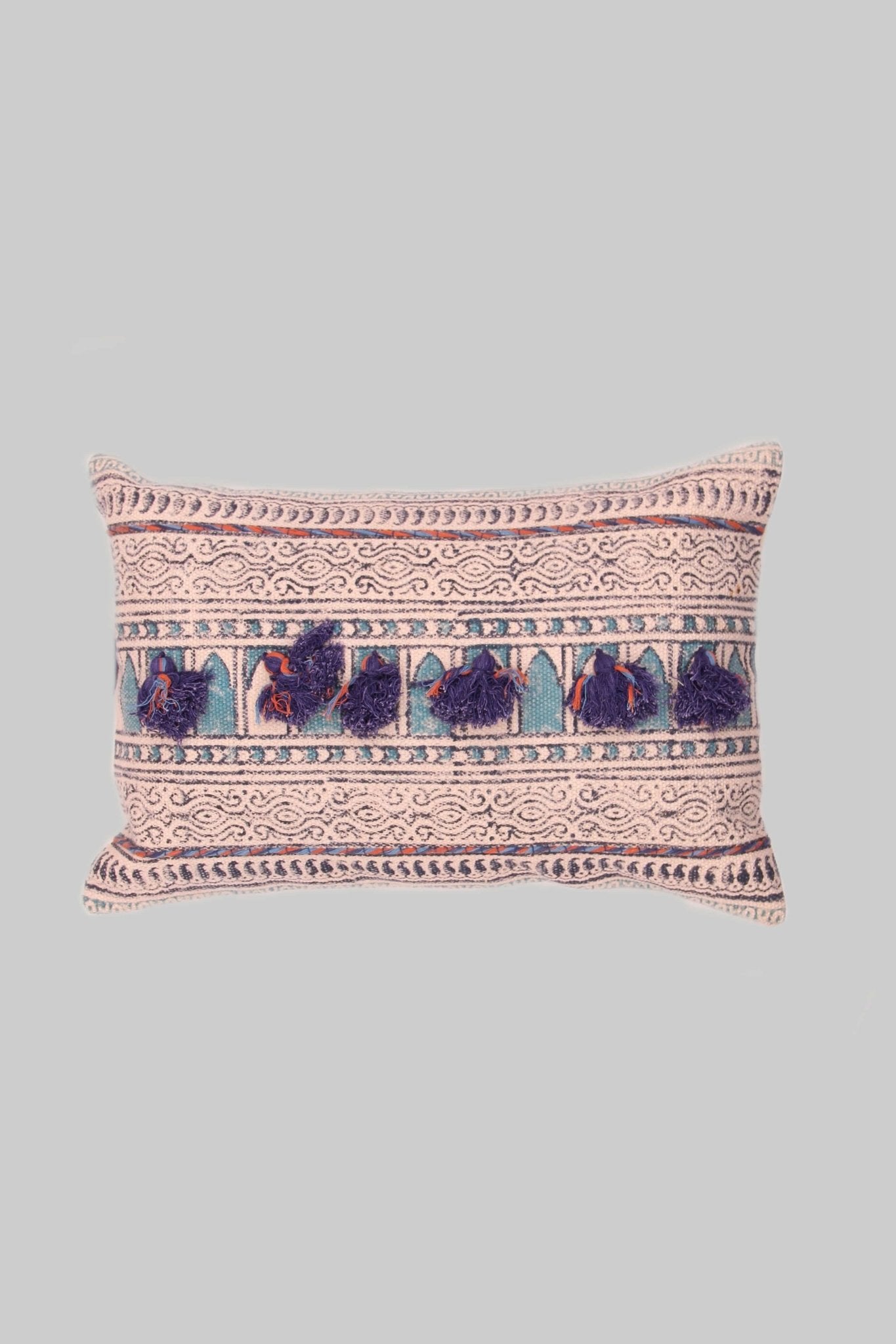 Block-printed embroidered lumbar cushion on sofa — Art Avenue