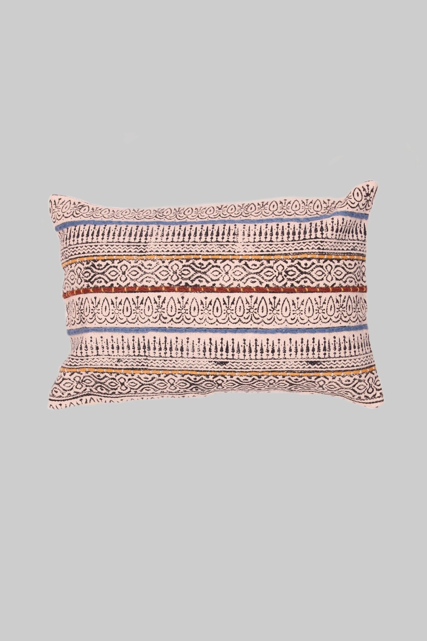 Block-printed embroidered lumbar cushion on sofa — Art Avenue