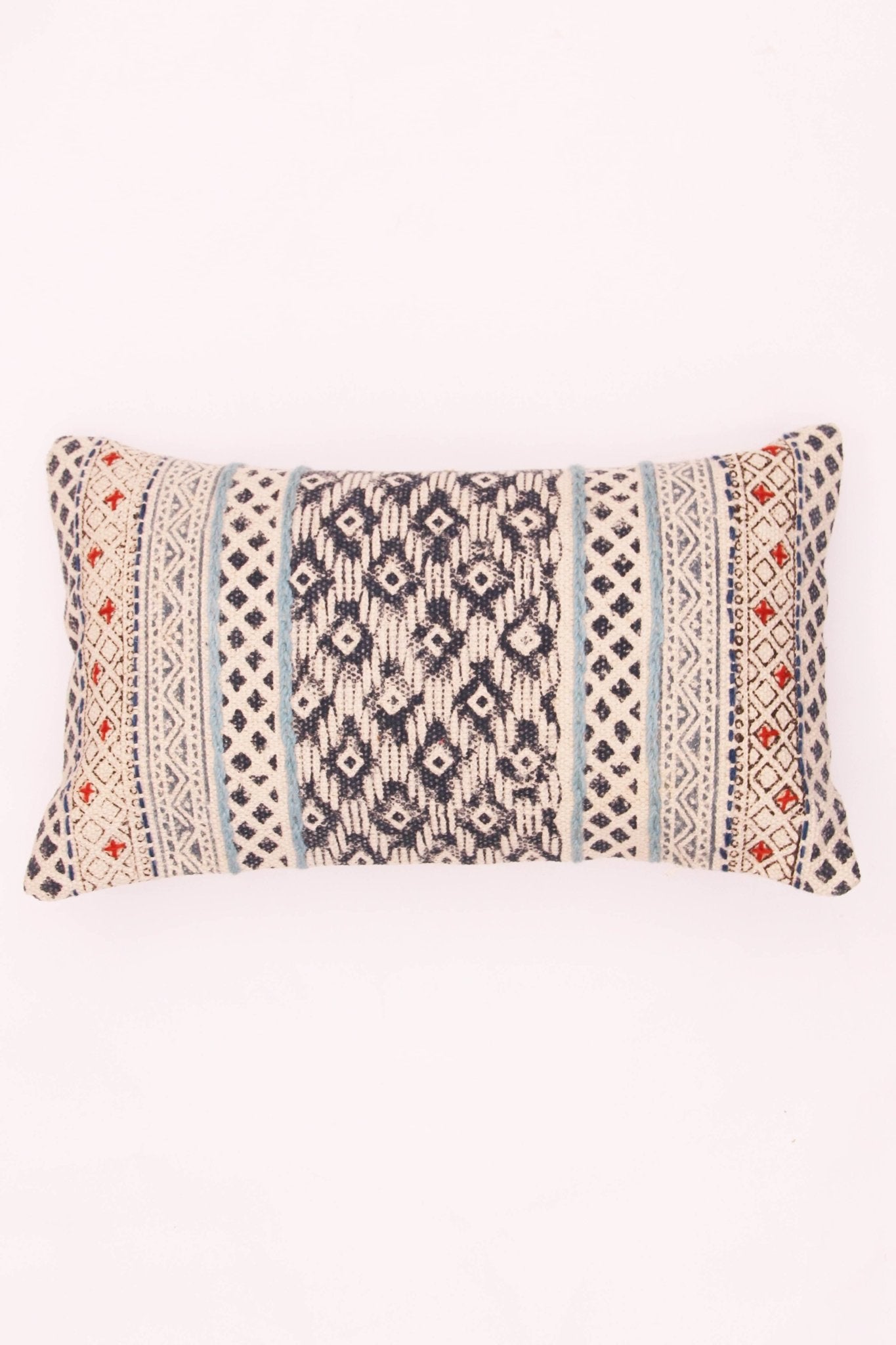 Block-printed embroidered lumbar cushion on sofa — Art Avenue