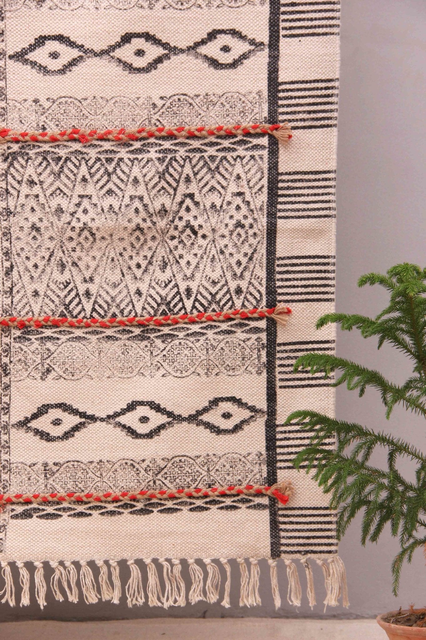 Block-printed cotton dhurrie rug in room setting — Art Avenue