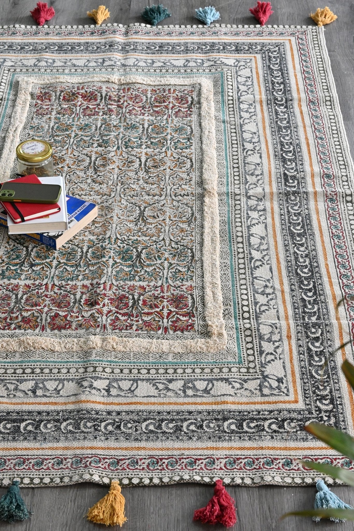 Block-printed cotton dhurrie rug with tassels in room setting — Art Avenue