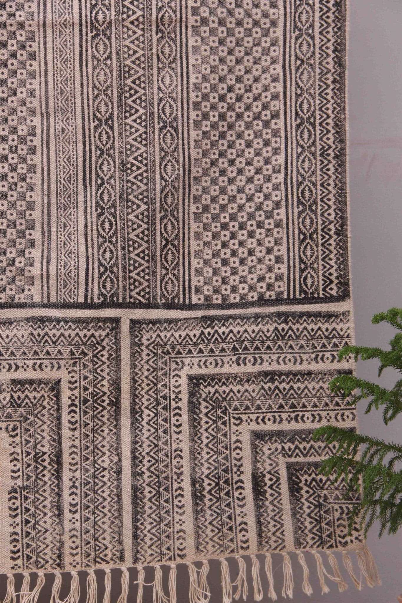 Detail of block-print on black dhurrie rug — Art Avenue