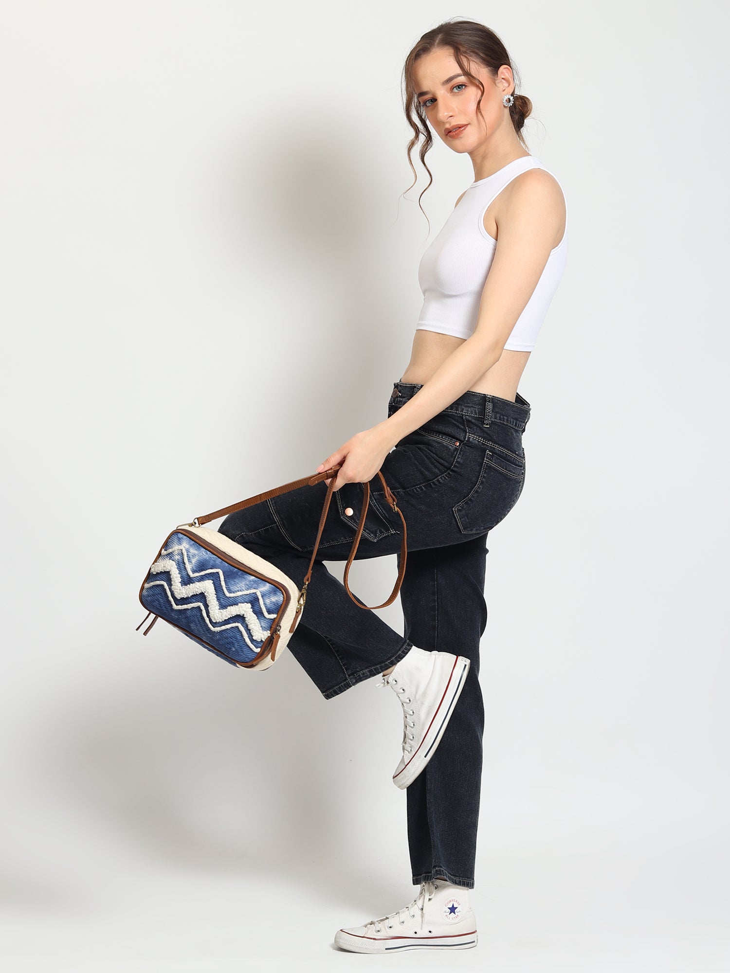 Luigina cotton and leather sling bag flat lay — Art Avenue
