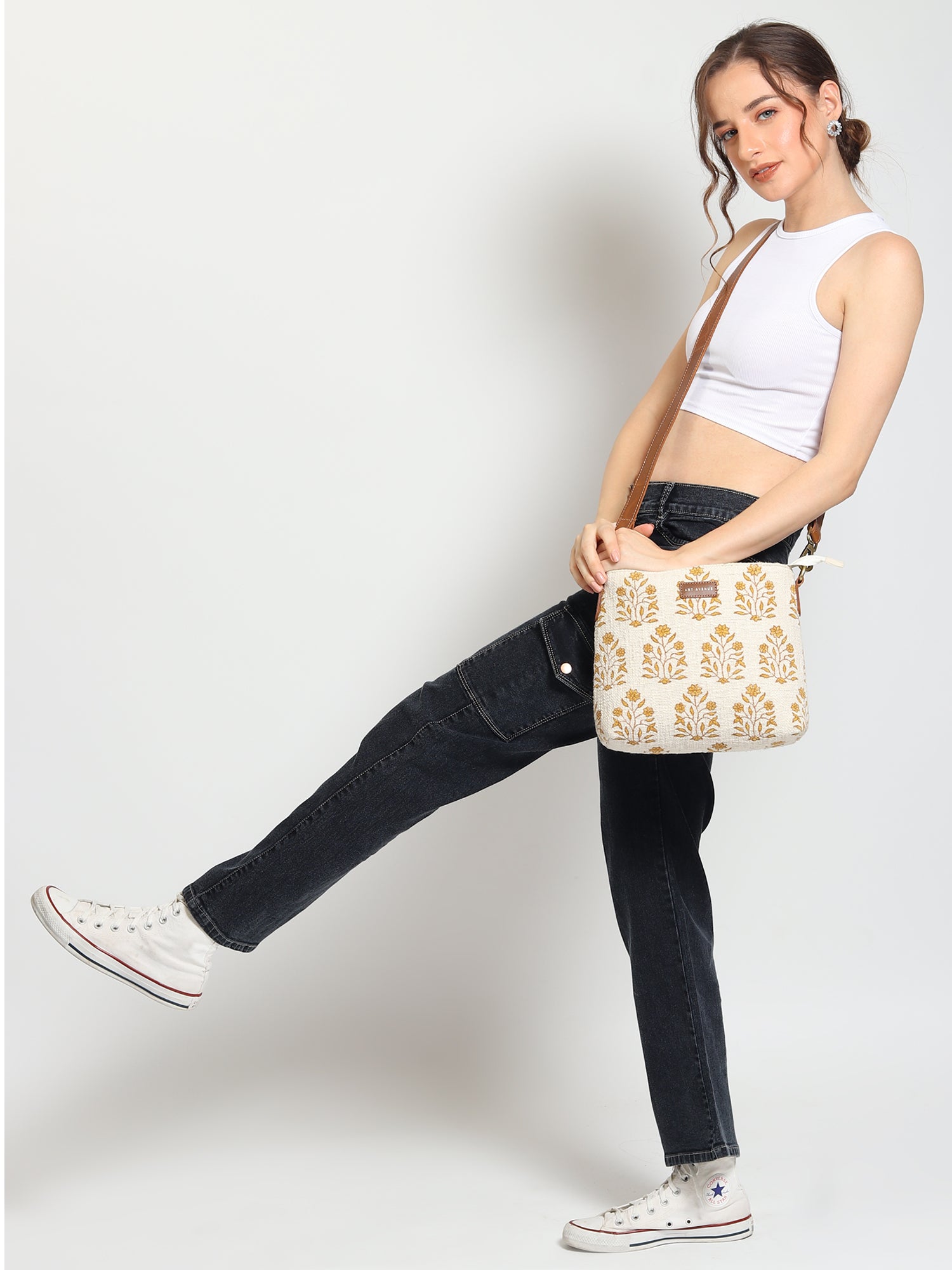 Charlie block-printed and leather sling bag closure detail — Art Avenue