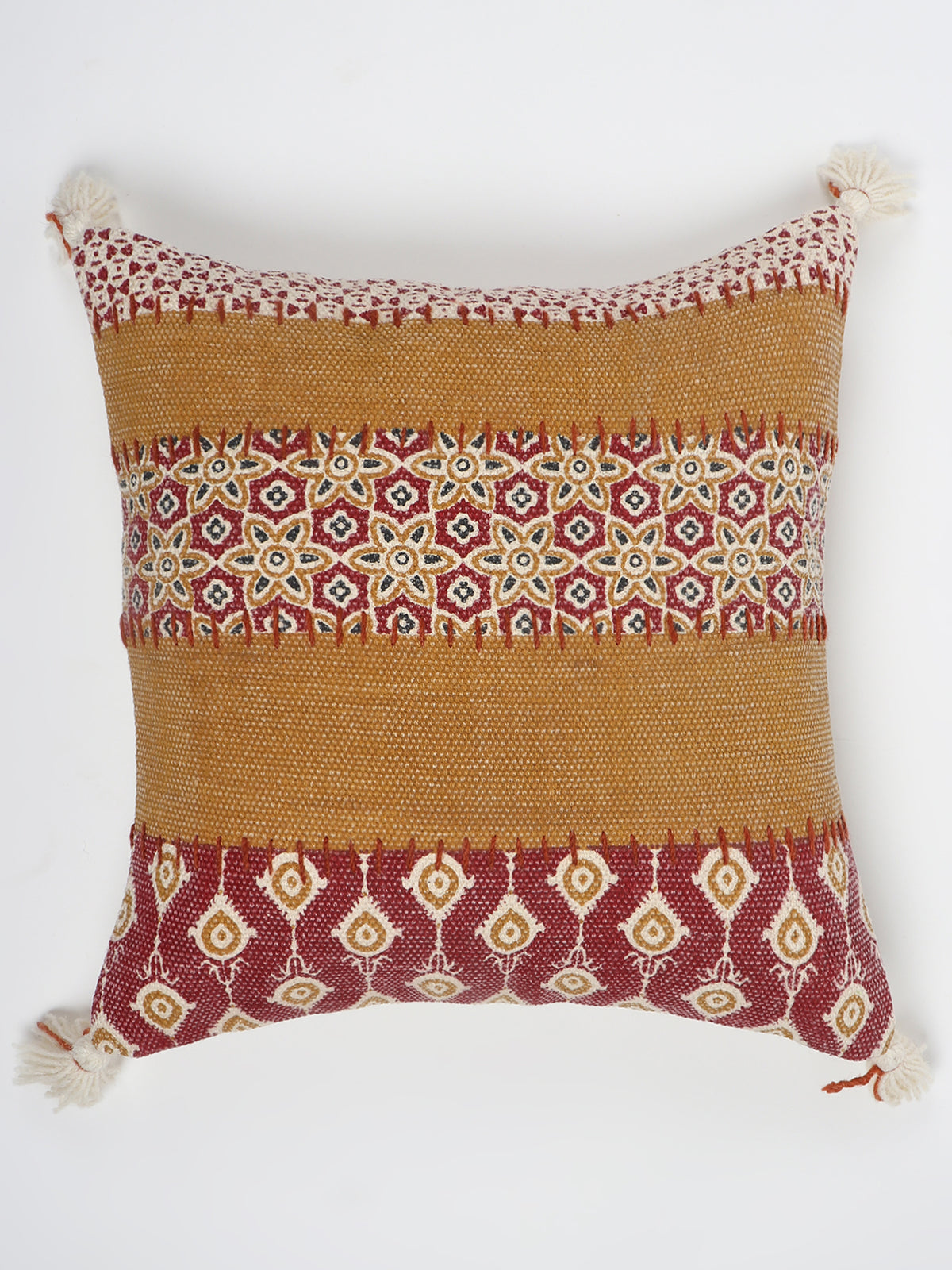 Detail of block-print embroidery on brown square cushion cover — Art Avenue