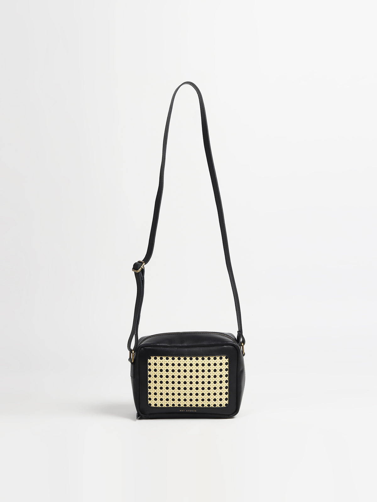 Laremy leather and cane sling bag, side view — Art Avenue