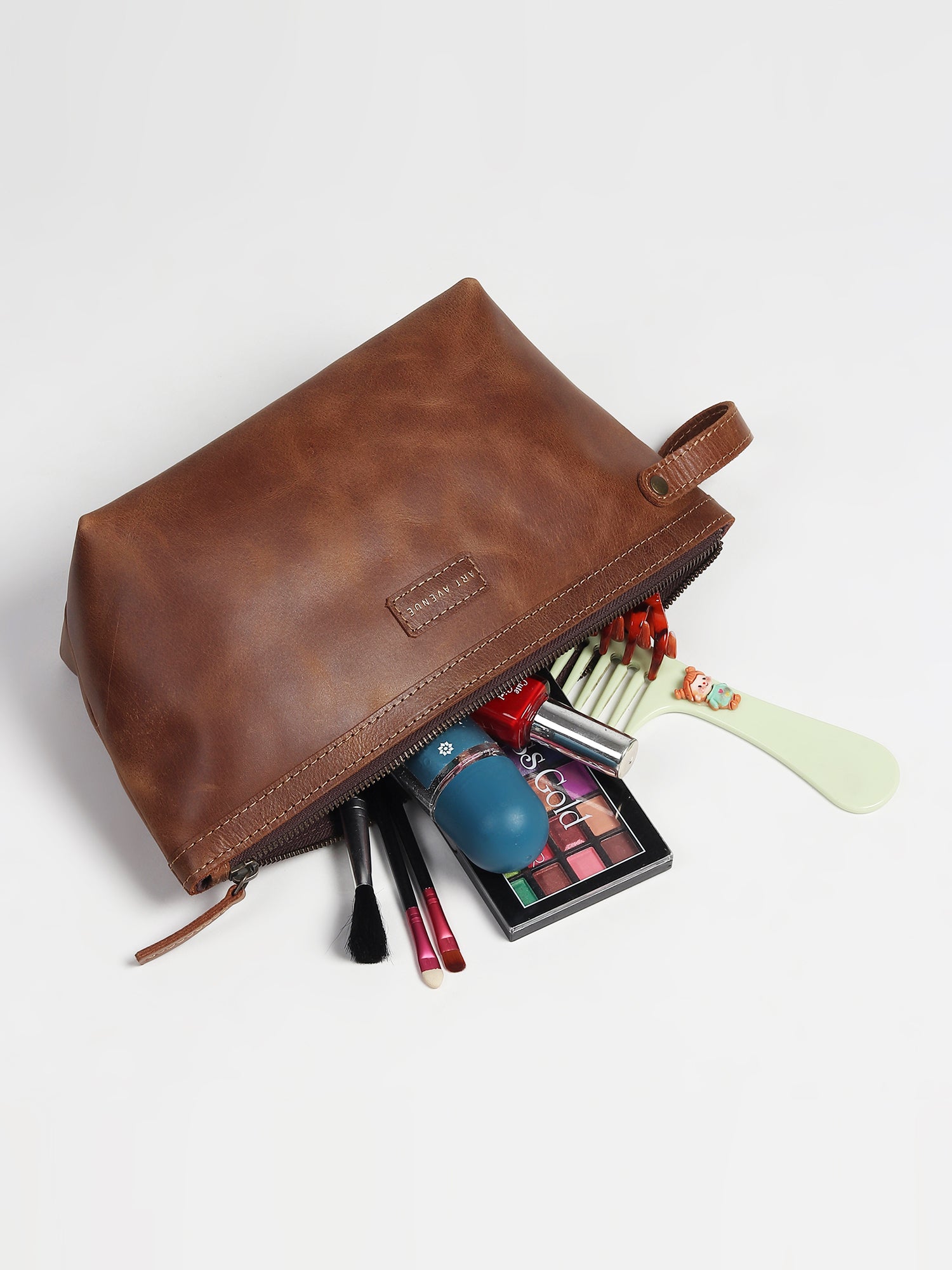 Flisk leather pouch flat lay — Art Avenue