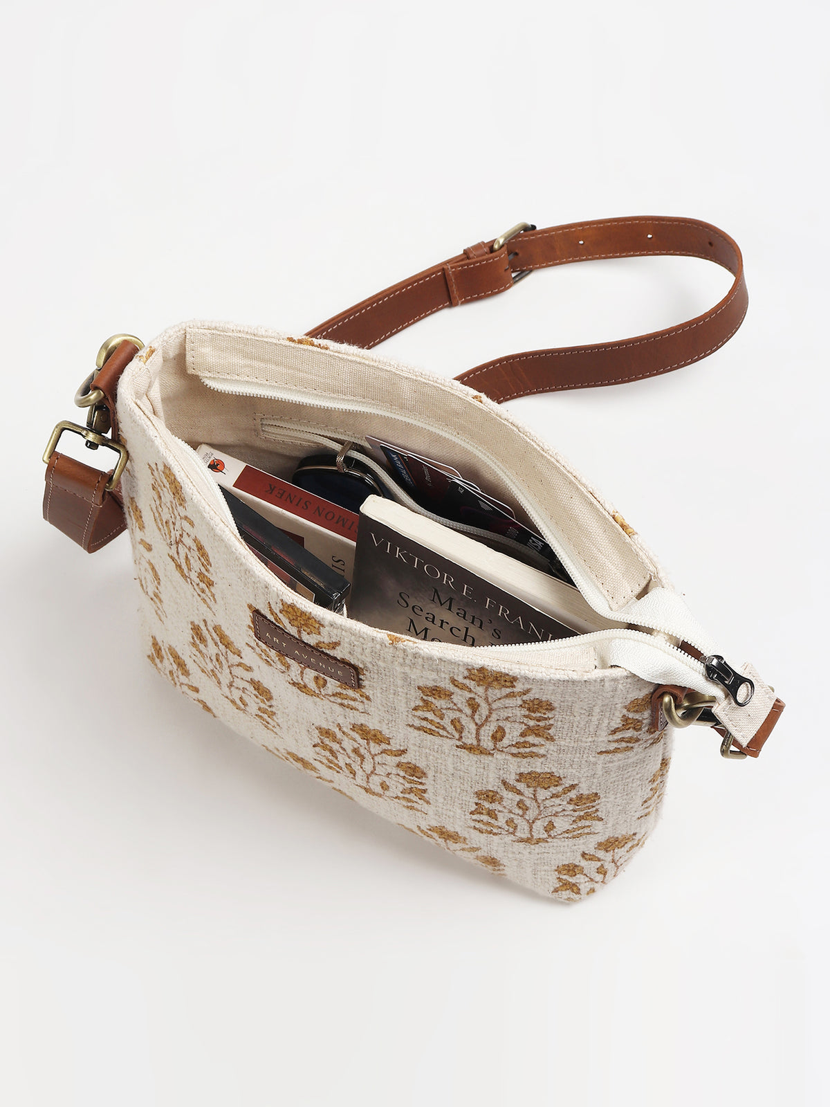Charlie leather sling bag on model — Art Avenue