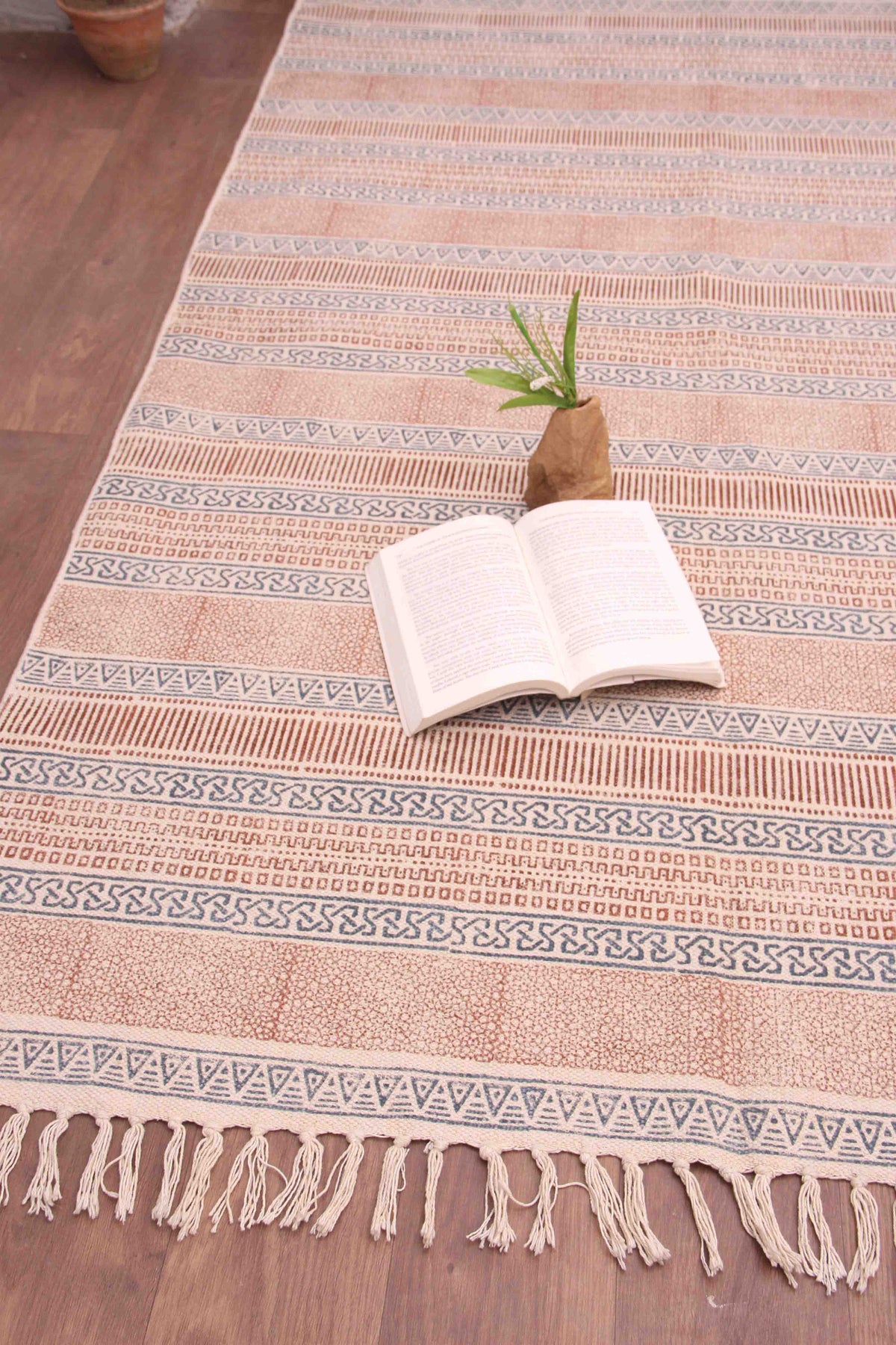 Detail of block-print on red dhurrie rug — Art Avenue
