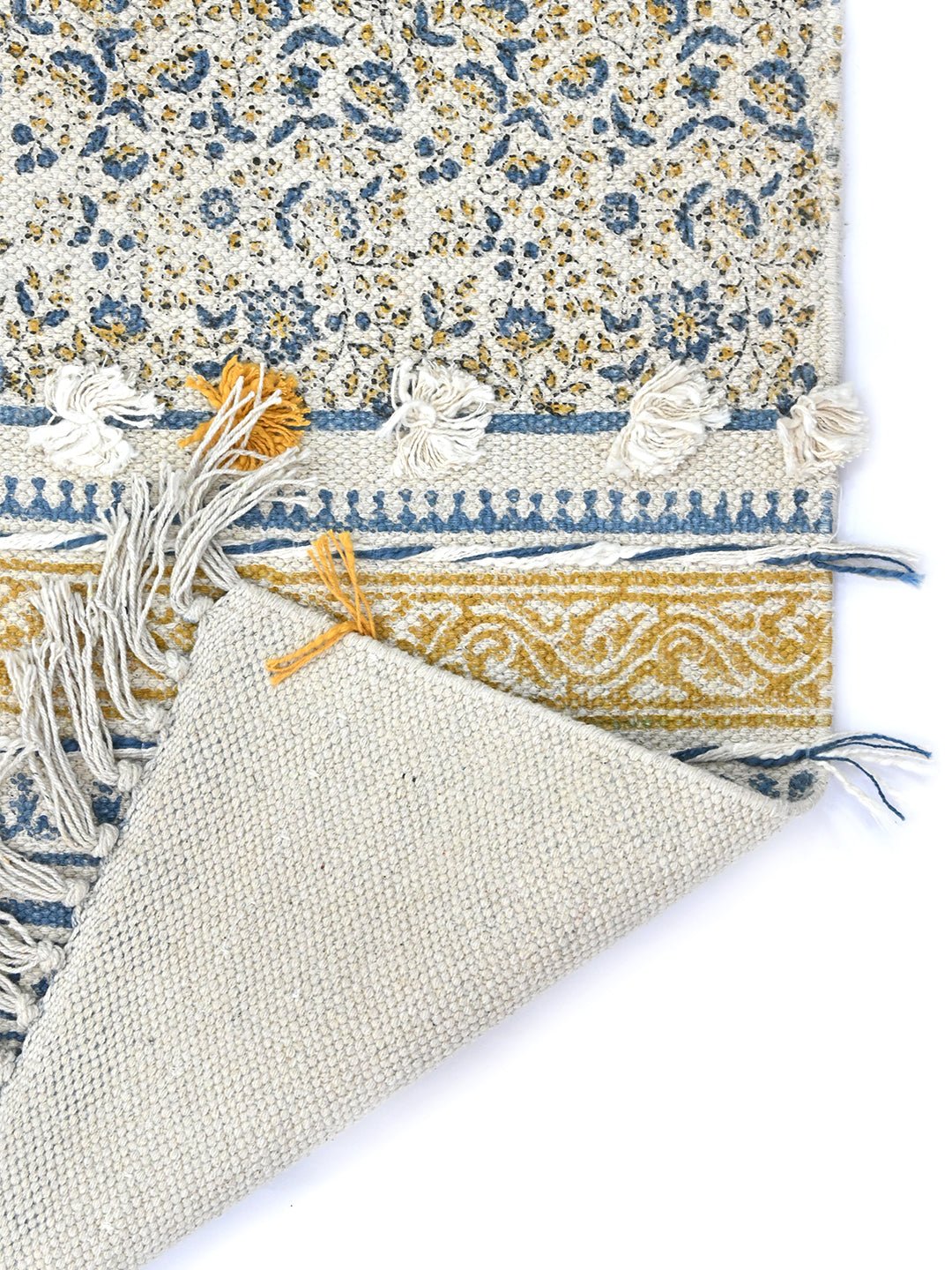 Detail of block-print floral pattern on cotton dhurrie rug — Art Avenue