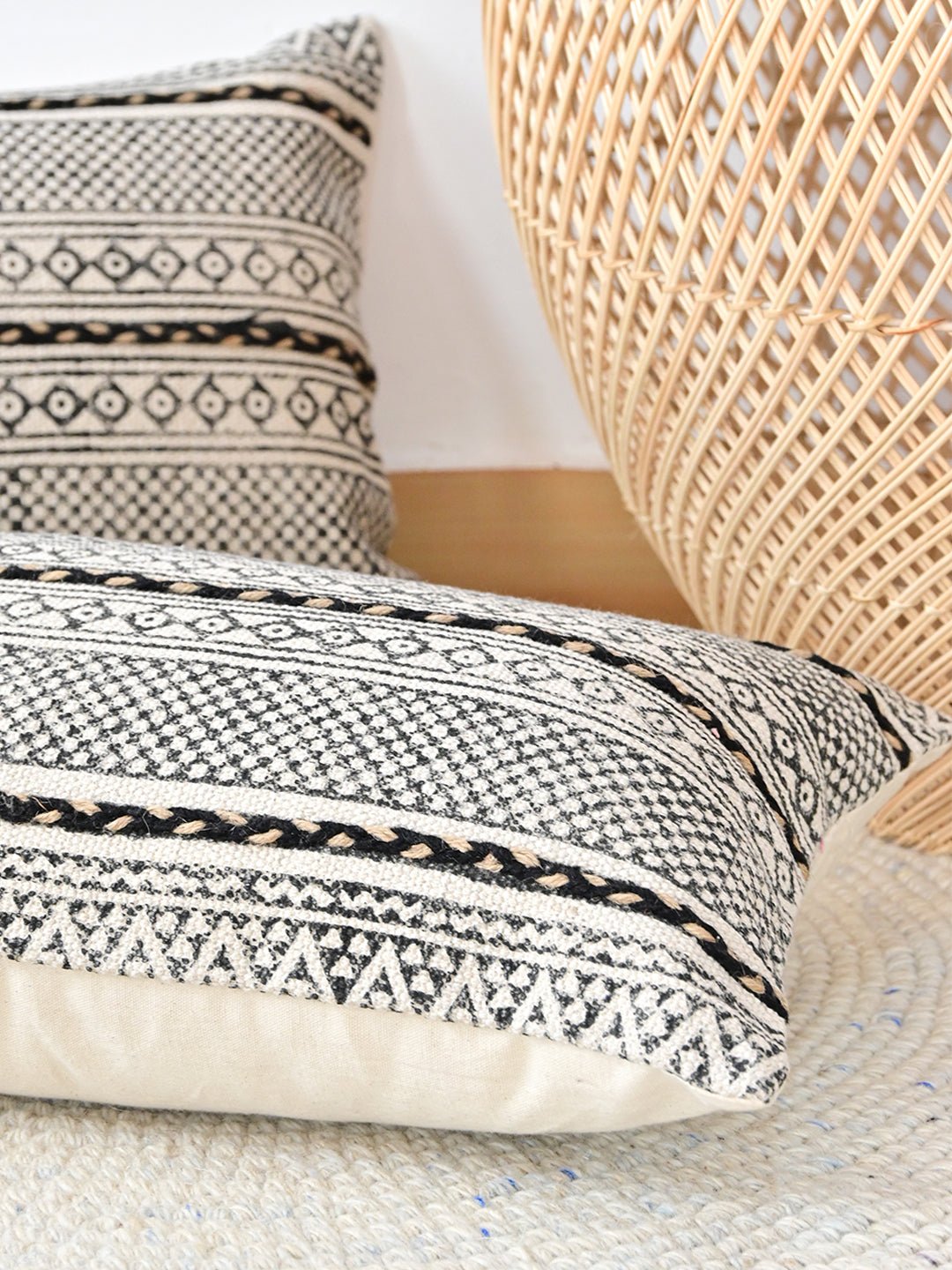 Block-printed embroidered lumbar cushion on sofa — Art Avenue