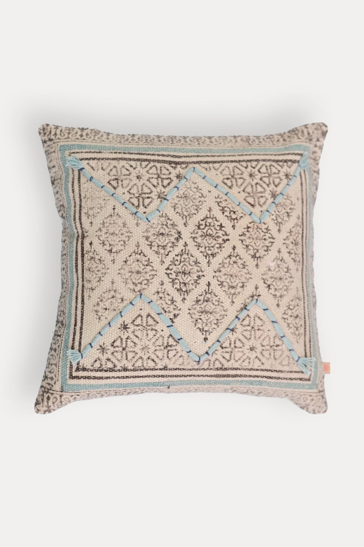 Block-printed square cushion on sofa — Art Avenue