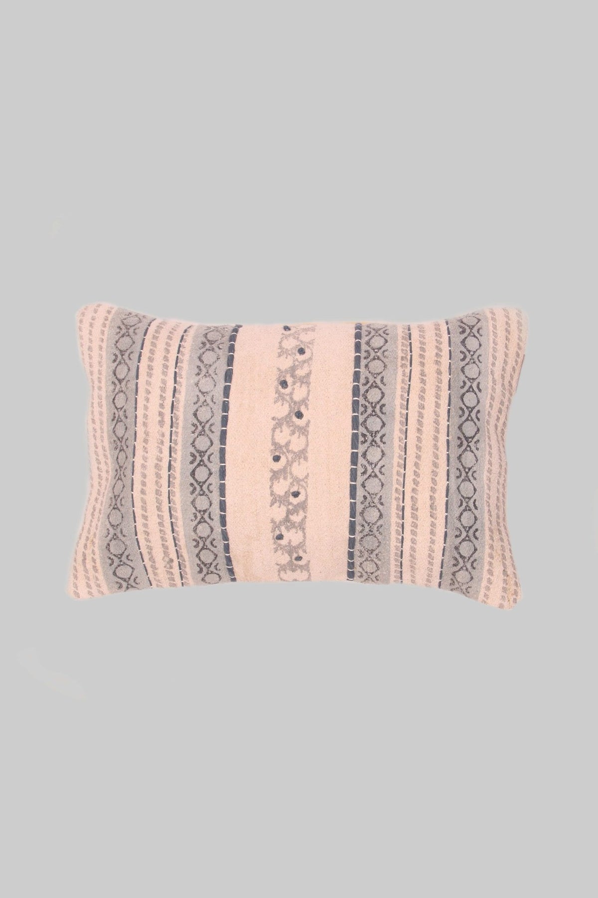 Block-printed embroidered lumbar cushion on sofa — Art Avenue