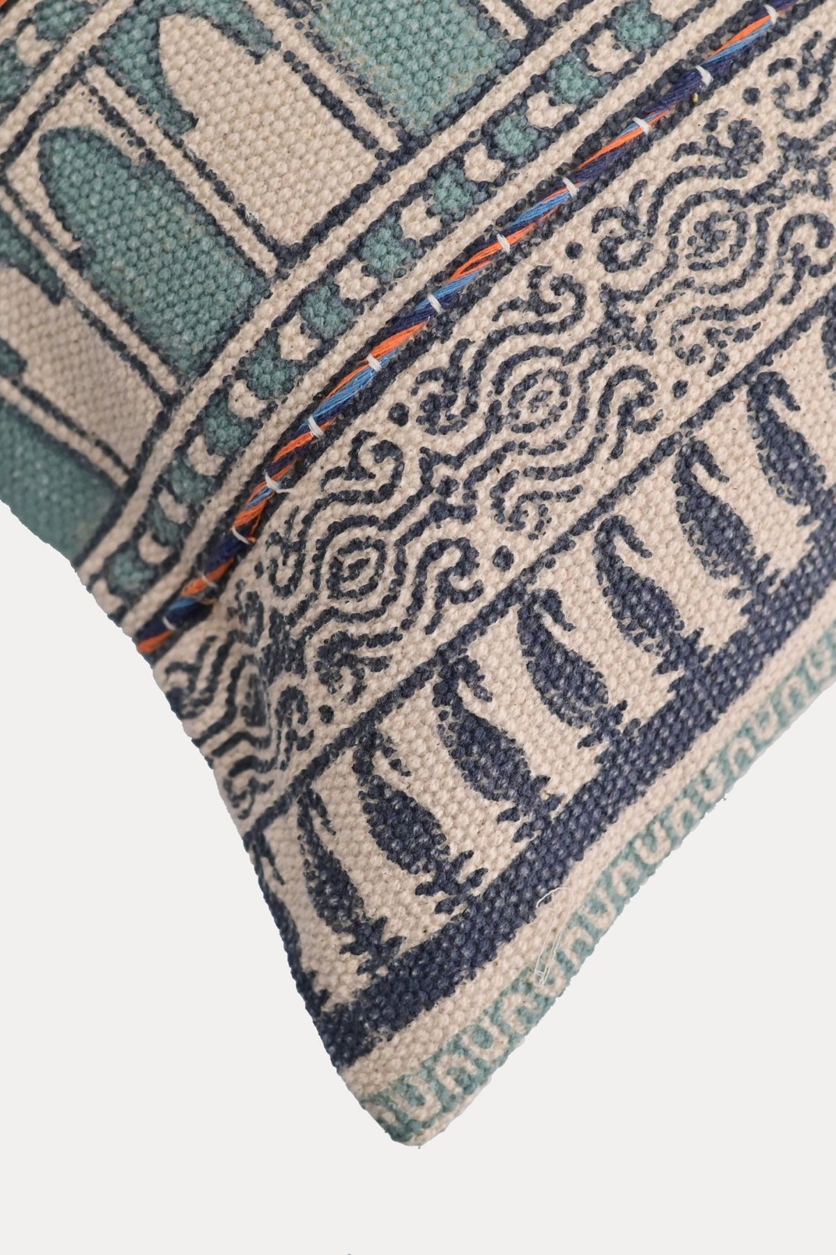 Detail of block-print embroidery on blue lumbar cushion cover — Art Avenue