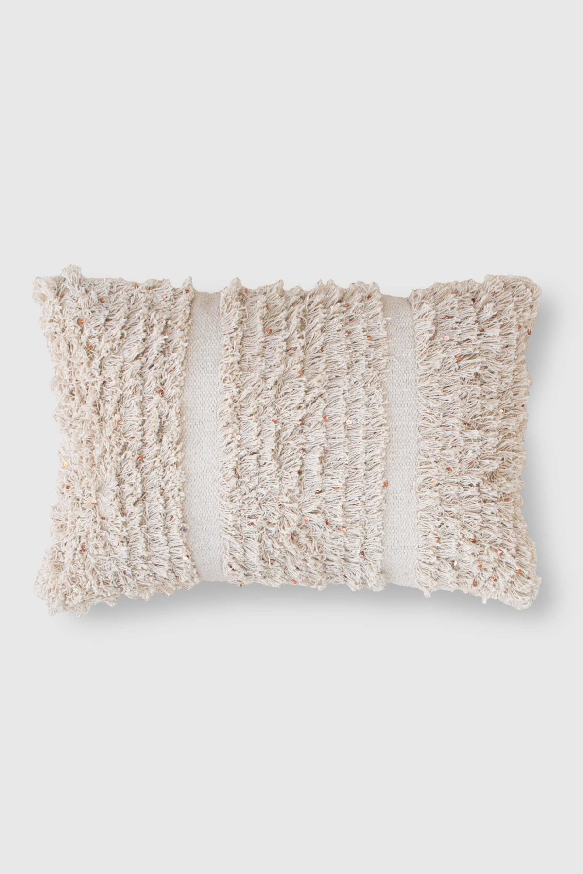 Handwoven sequin shaggy lumbar cushion on sofa — Art Avenue