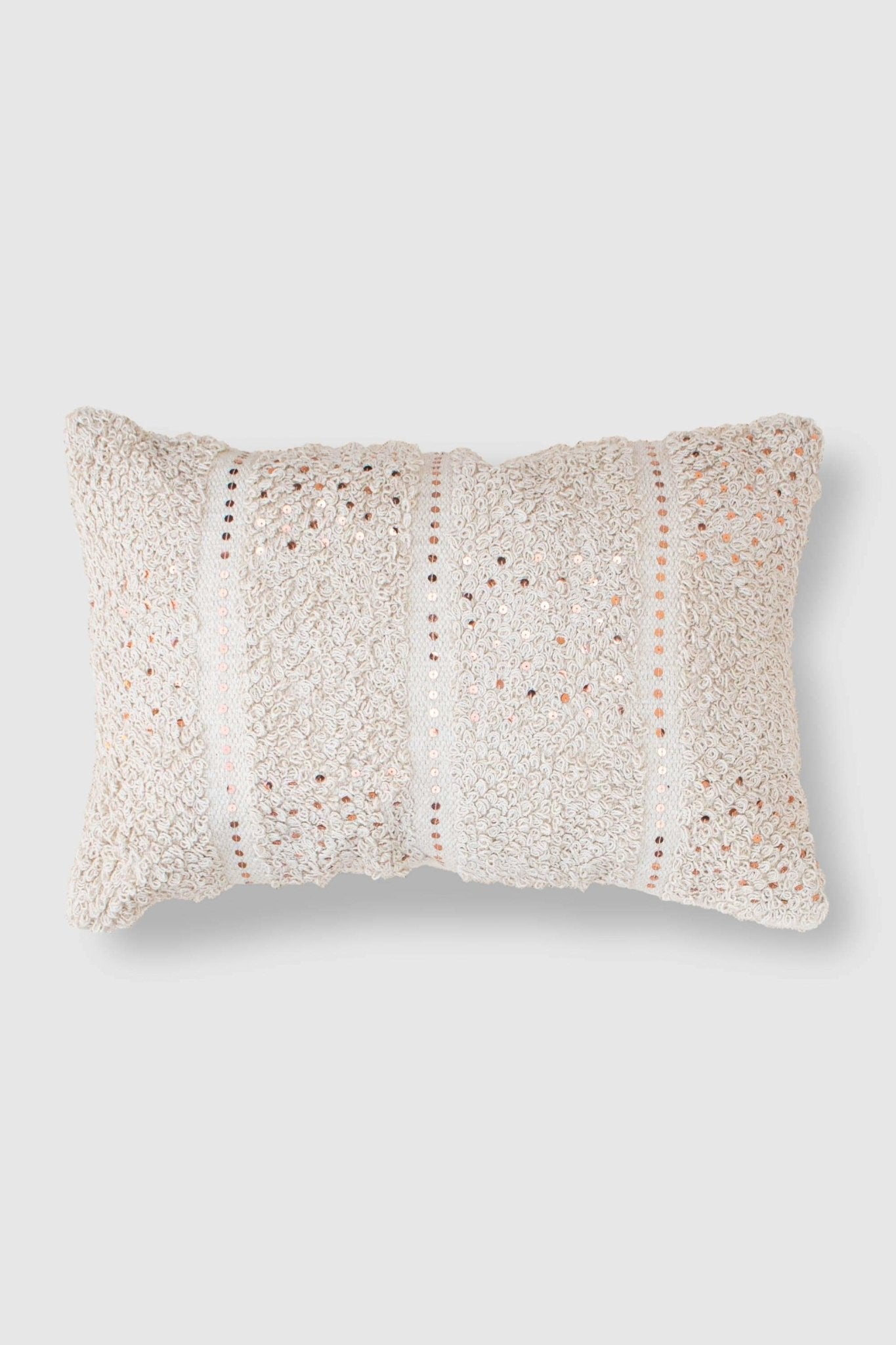 Handwoven sequin shaggy lumbar cushion on sofa — Art Avenue