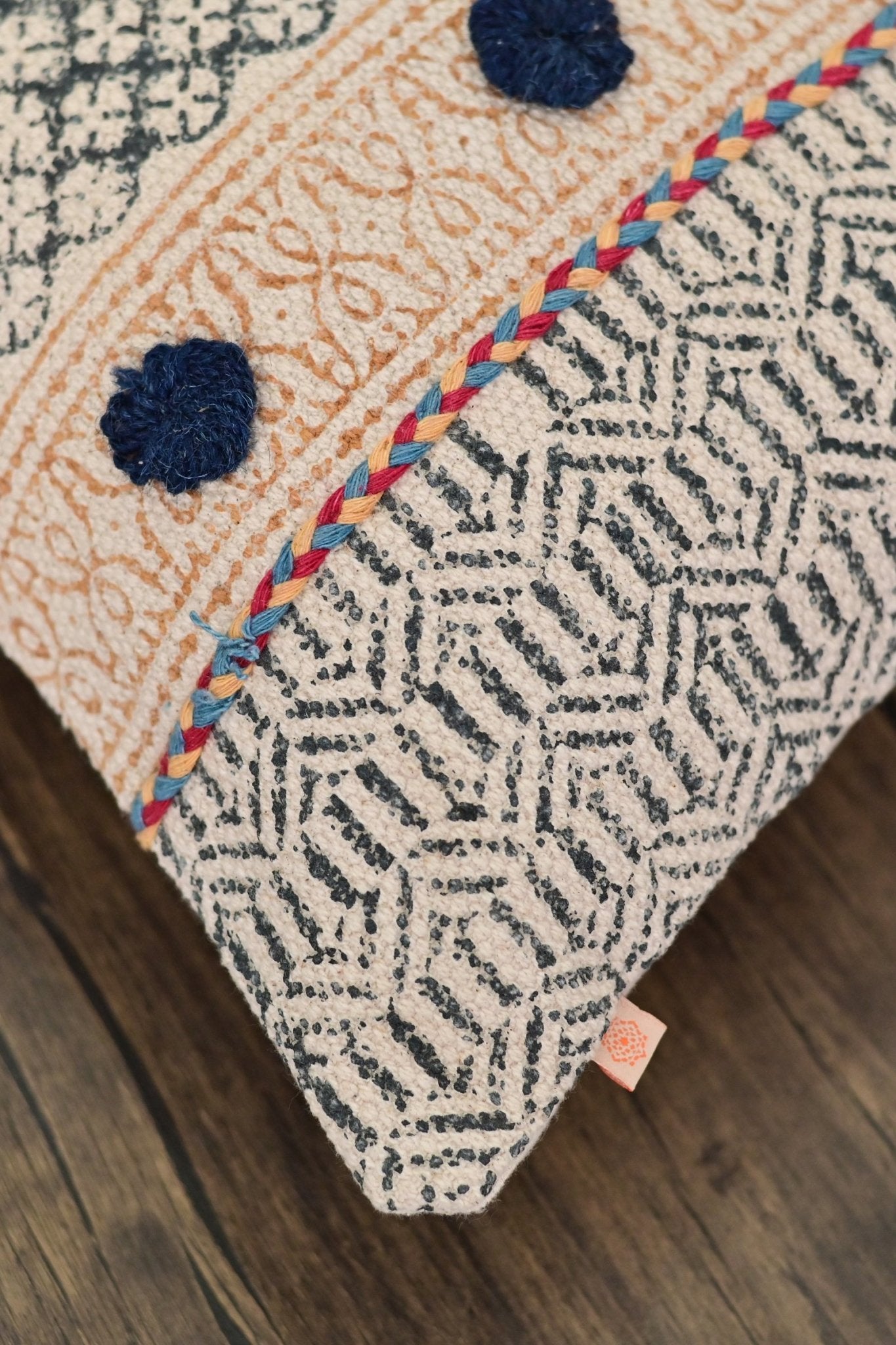 Detail of block-print on orange square cushion cover — Art Avenue