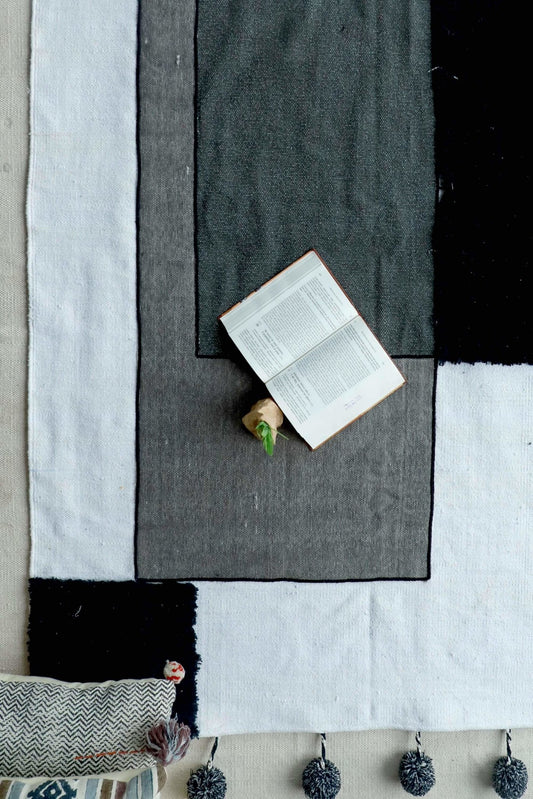Kelki patchwork rug with pom-poms — handmade in Jaipur