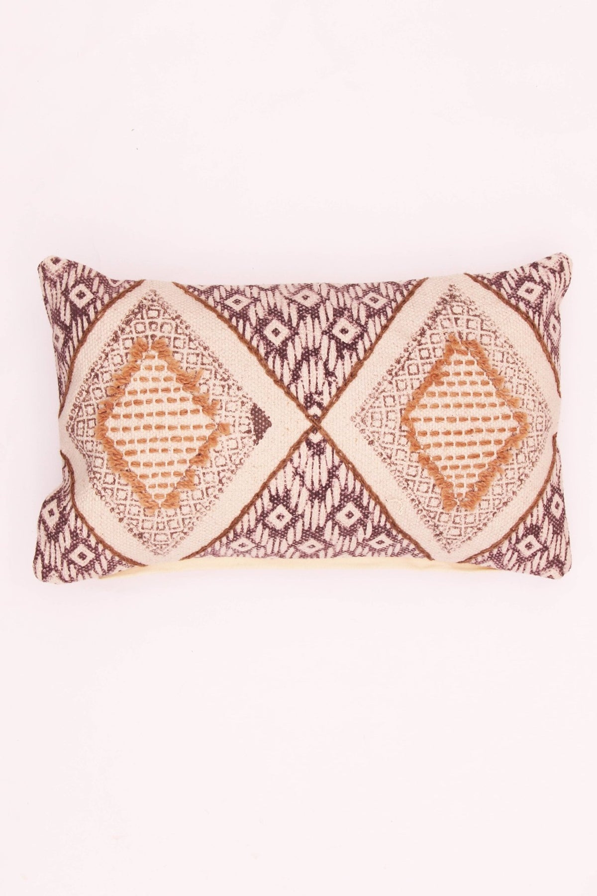 Block-printed embroidered lumbar cushion on sofa — Art Avenue