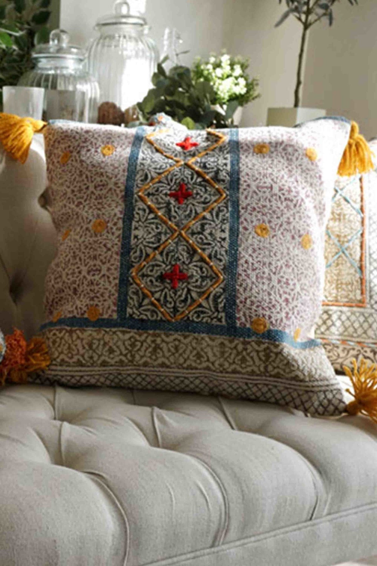 Block-printed square cushion on sofa — Art Avenue