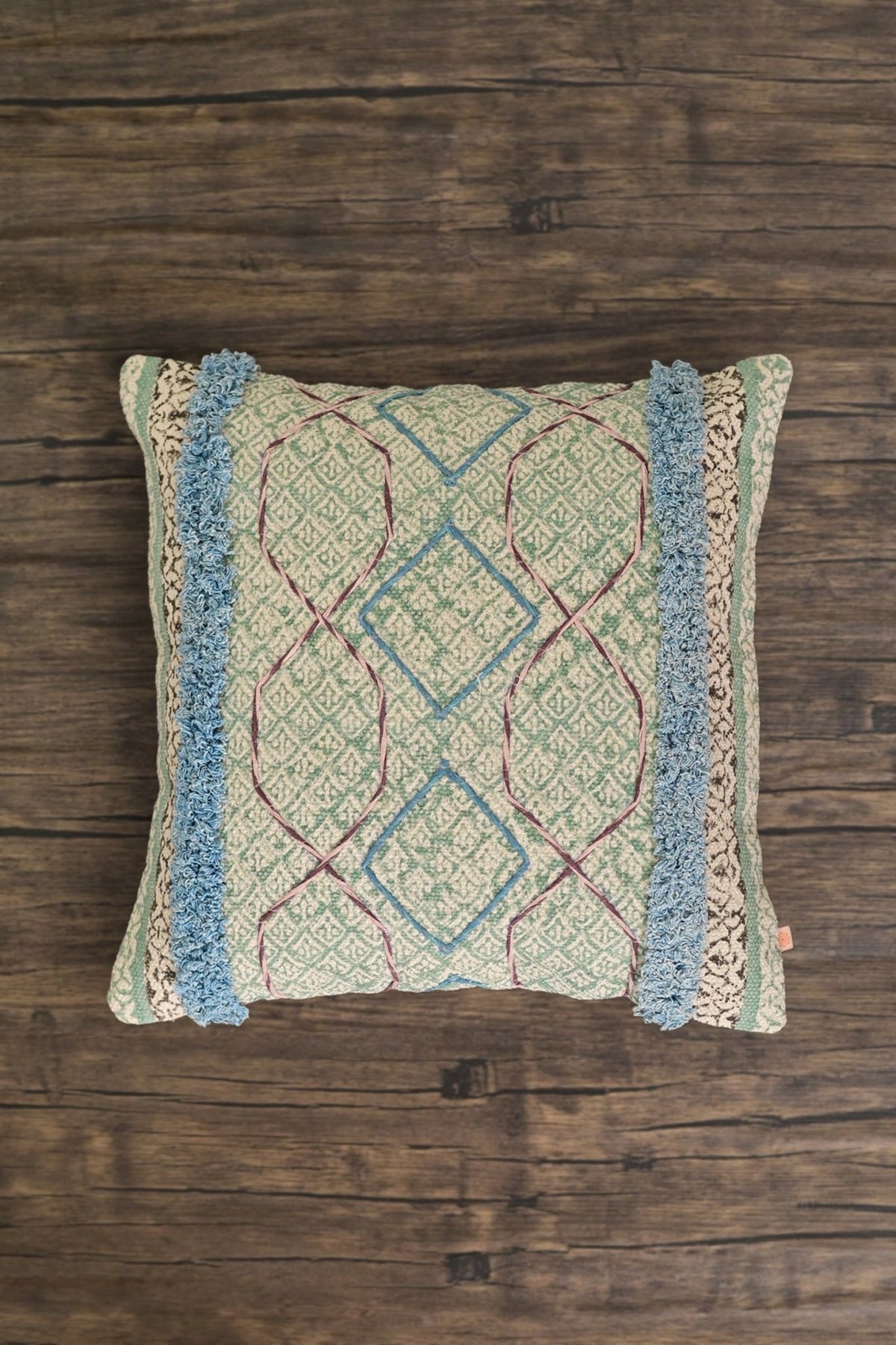 Block-printed square cushion on sofa — Art Avenue