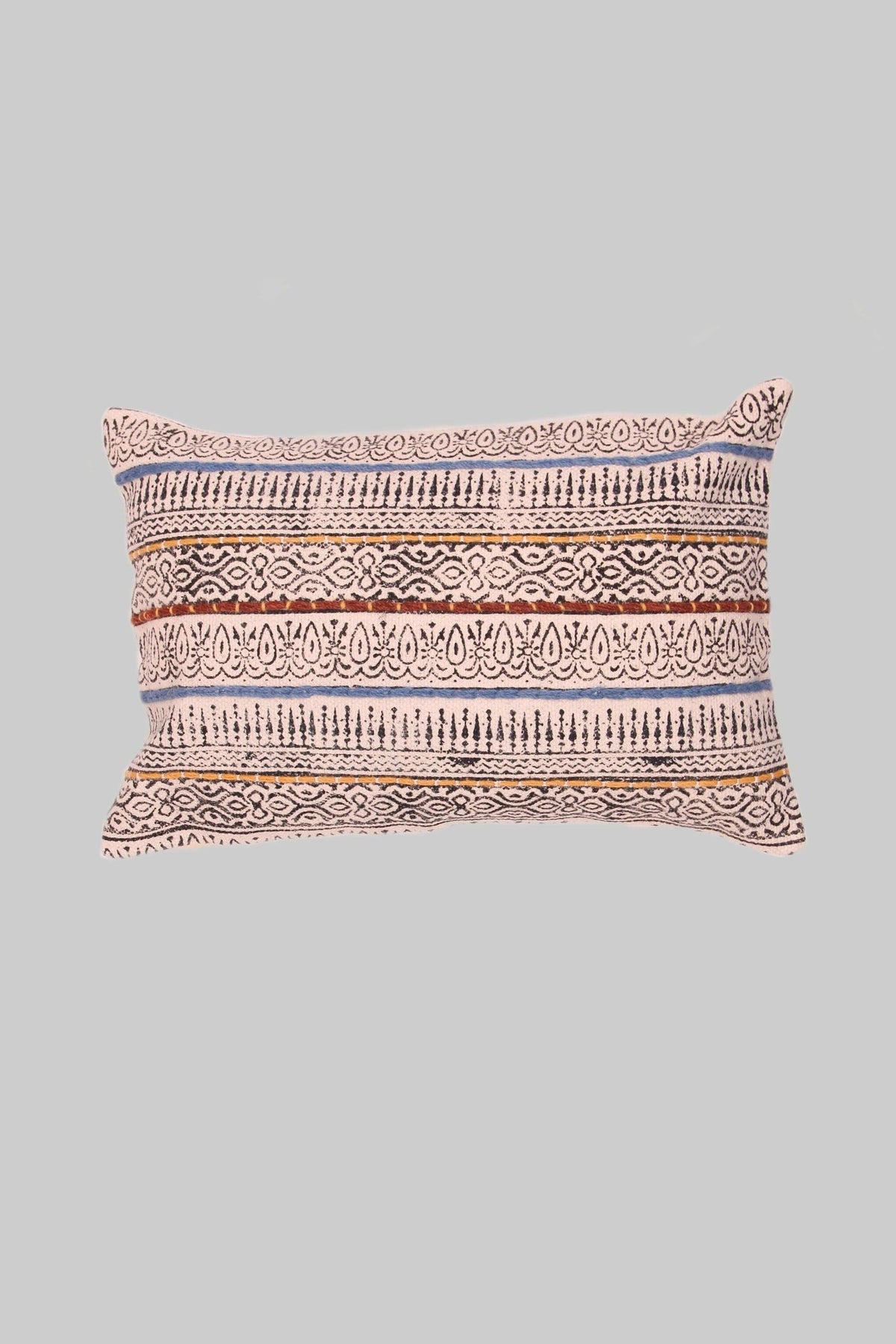 Block-printed embroidered lumbar cushion on sofa — Art Avenue