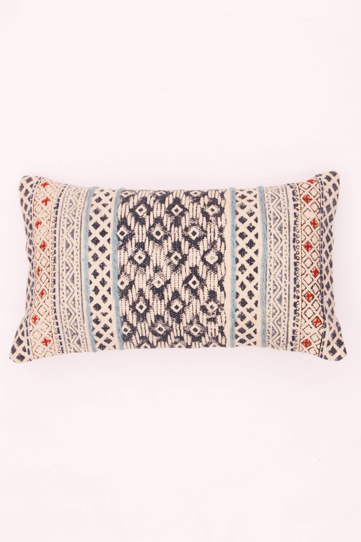 Block-printed embroidered lumbar cushion on sofa — Art Avenue