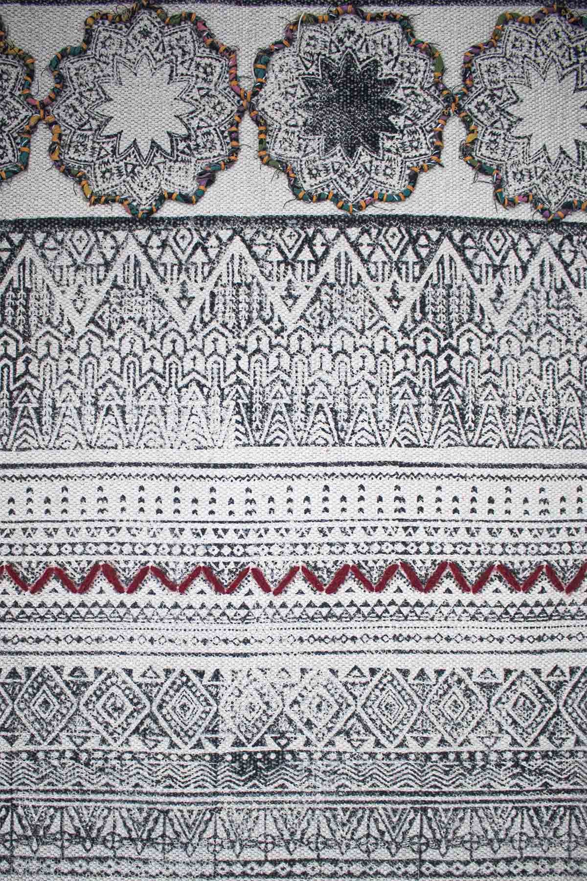 Block-printed cotton dhurrie rug in room setting — Art Avenue