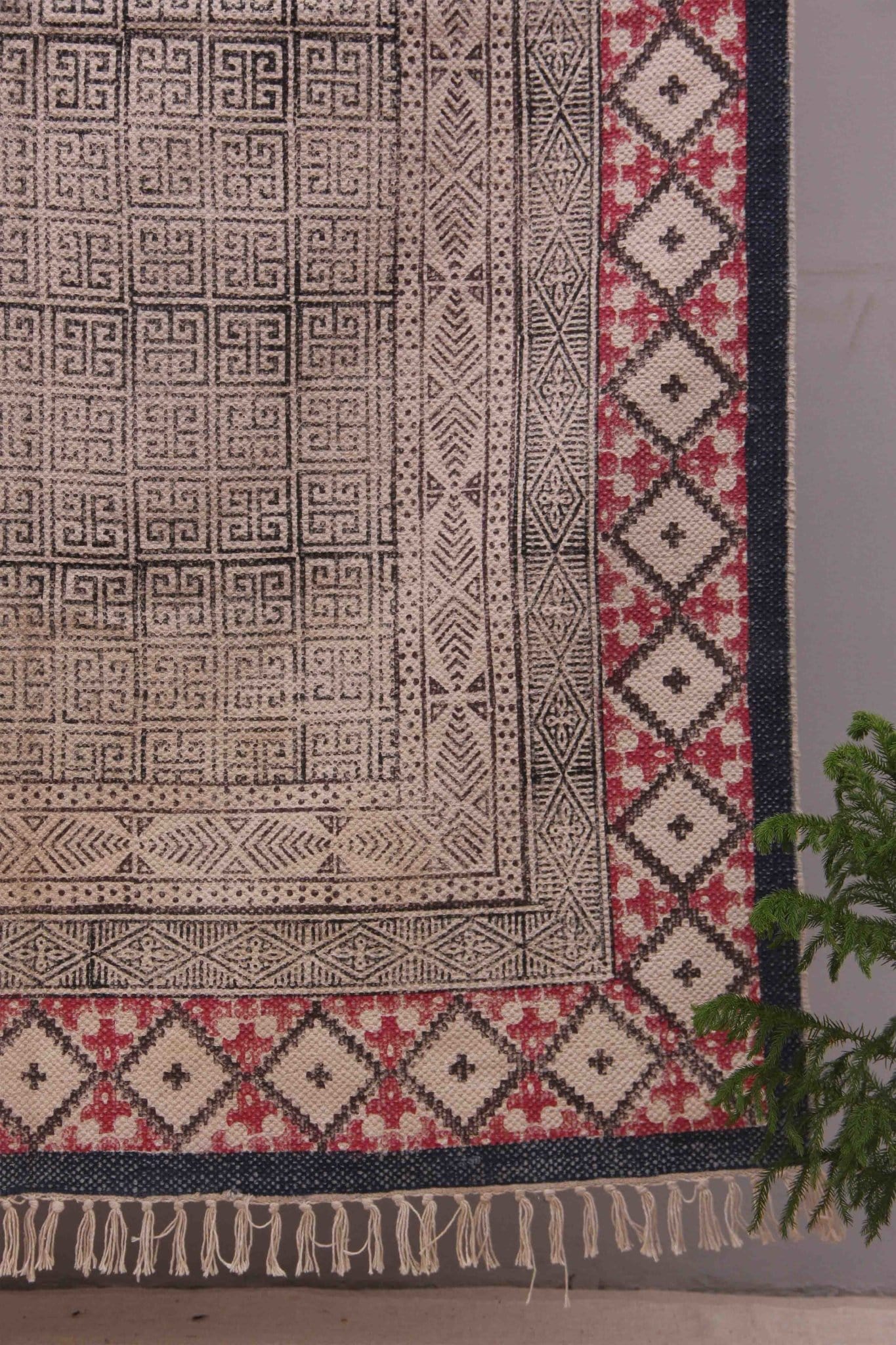 Block-printed cotton dhurrie rug in room setting — Art Avenue
