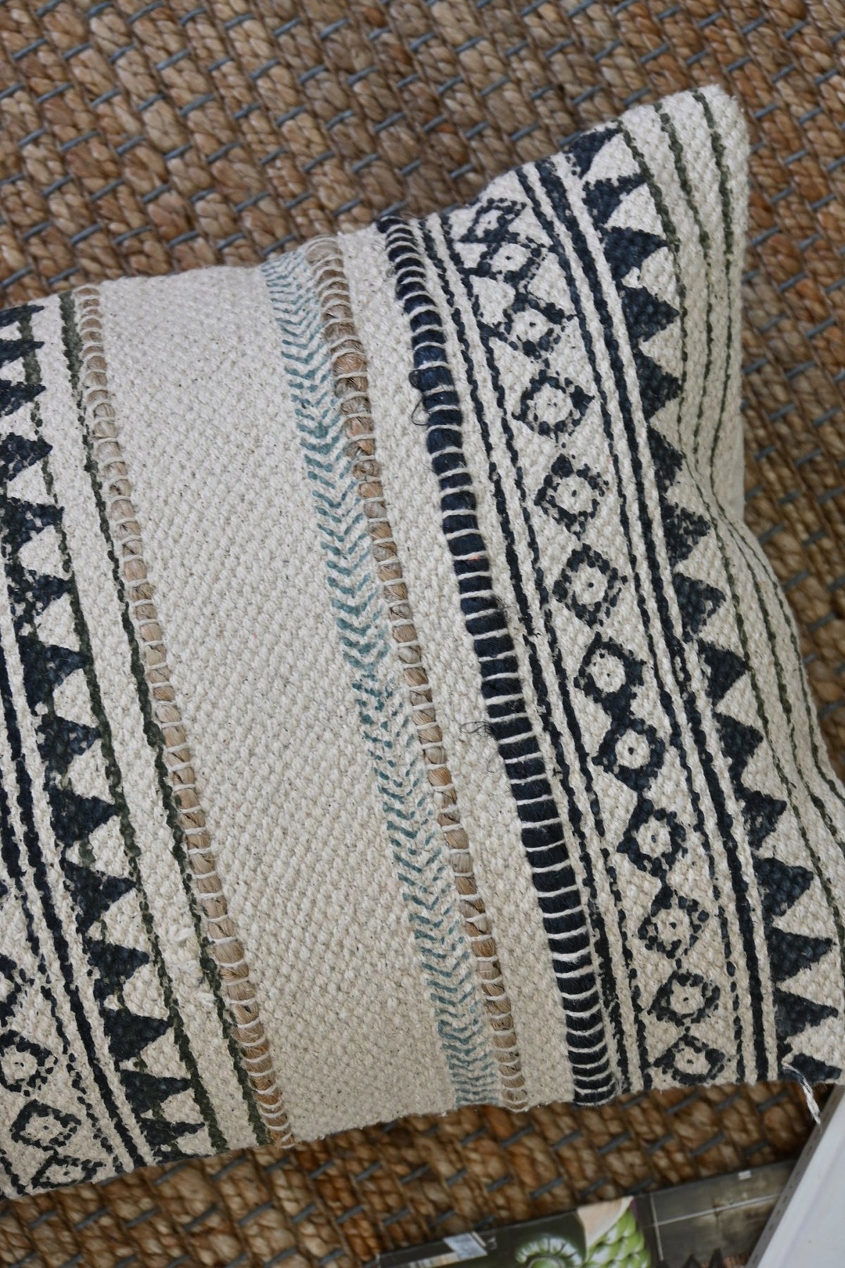 Block-printed embroidered lumbar cushion on sofa — Art Avenue